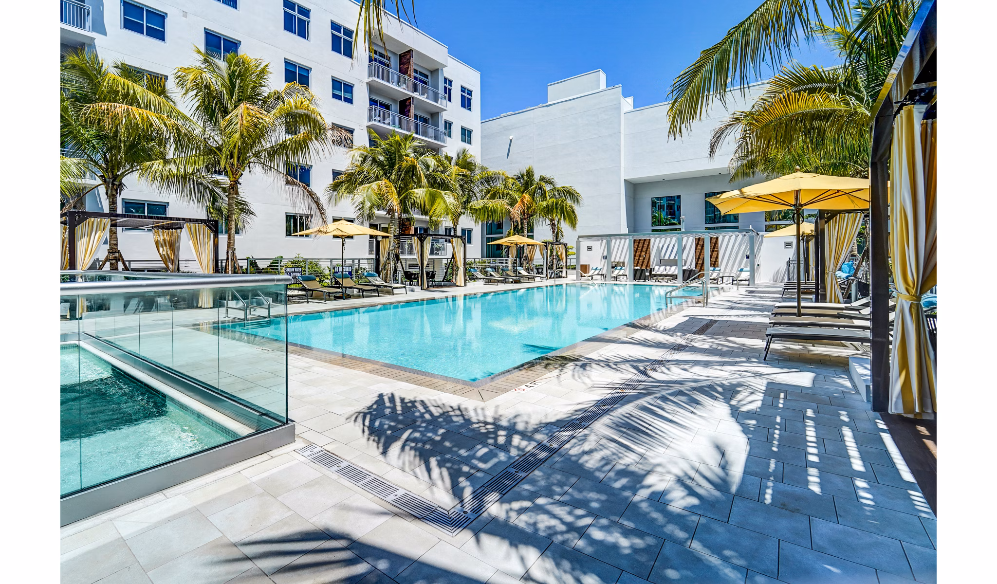 Stylish pool at Oversea at Flagler Banyan Square Apartments offering luxury relaxation in a vibrant community