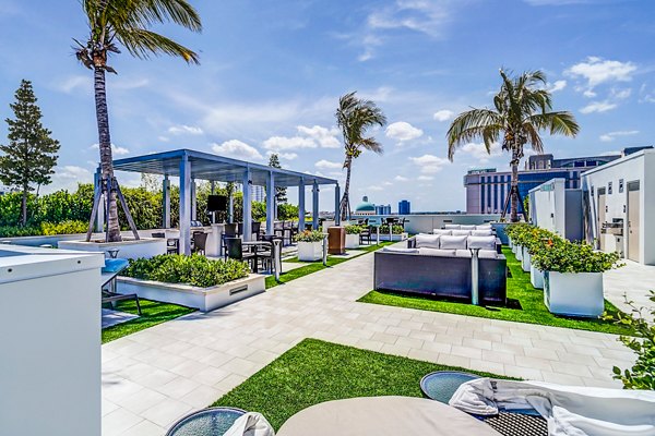 Peaceful courtyard with lush greenery at Oversea at Flagler Banyan Square Apartments