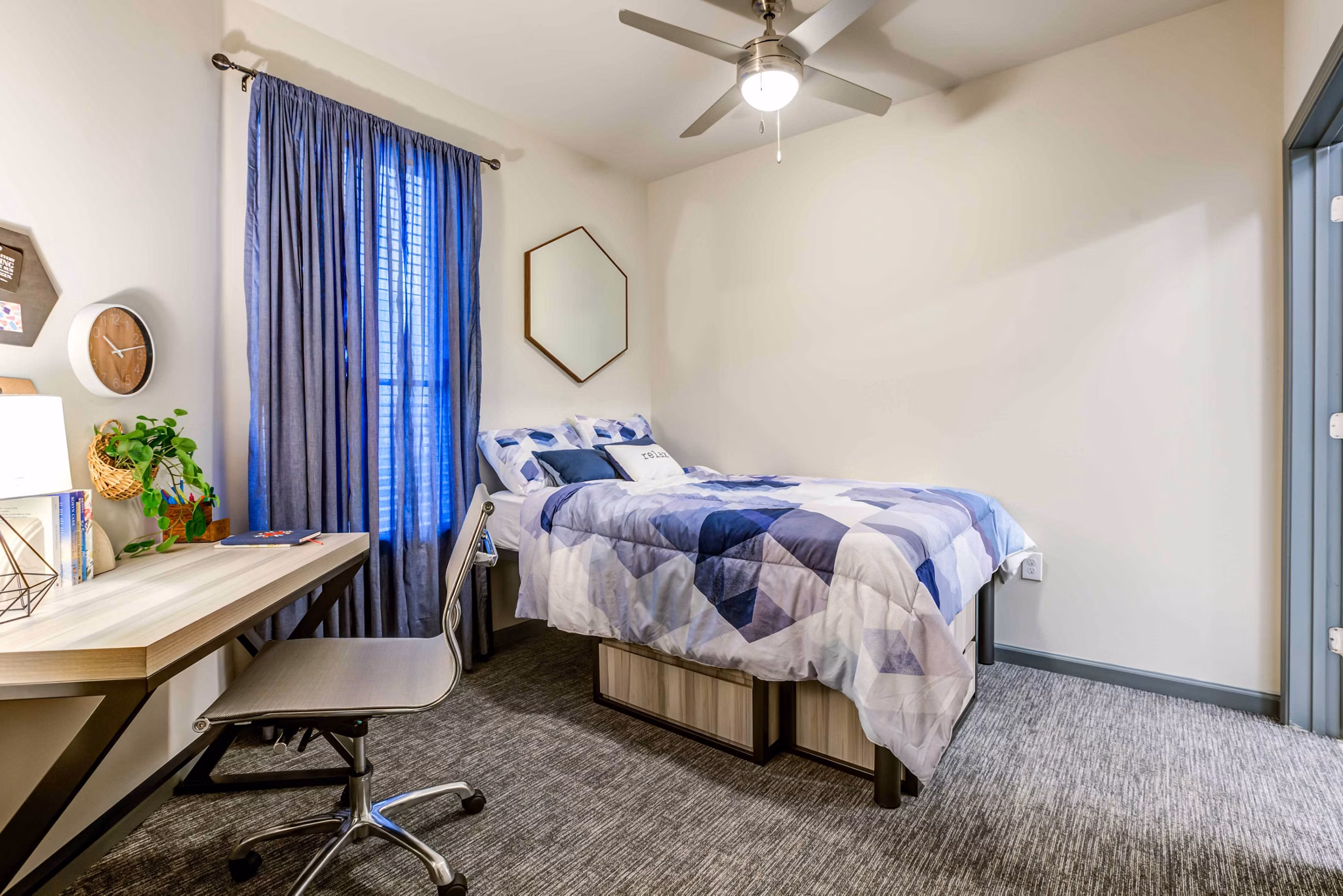 Union on Fletcher Apartments: Modern bedroom featuring stylish decor and ample natural light for luxury living