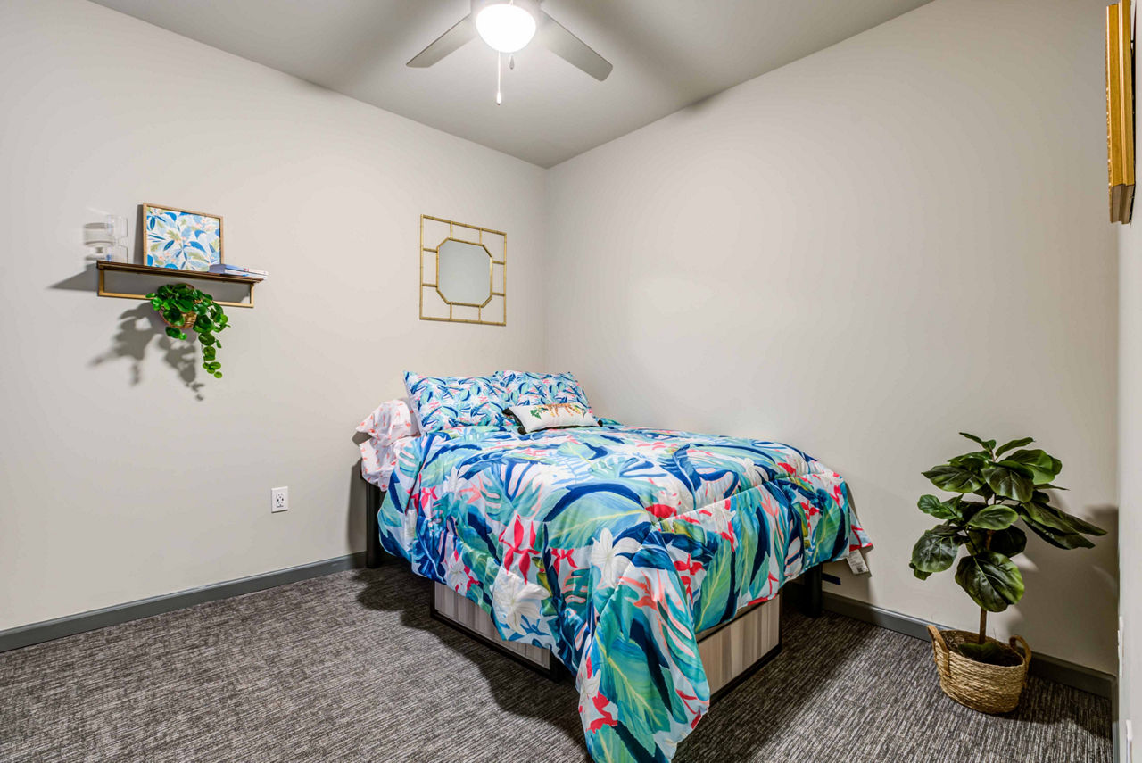 Cozy bedroom with modern furnishings at Union on Fletcher Apartments