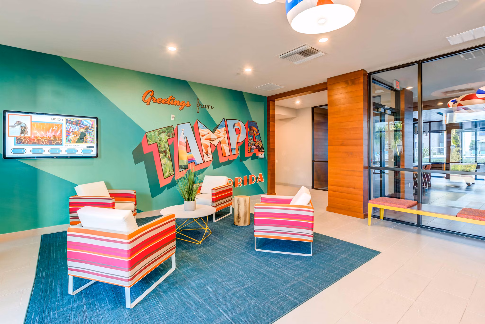 Clubhouse with elegant seating and modern decor at Union on Fletcher Apartments, a Greystar luxury property