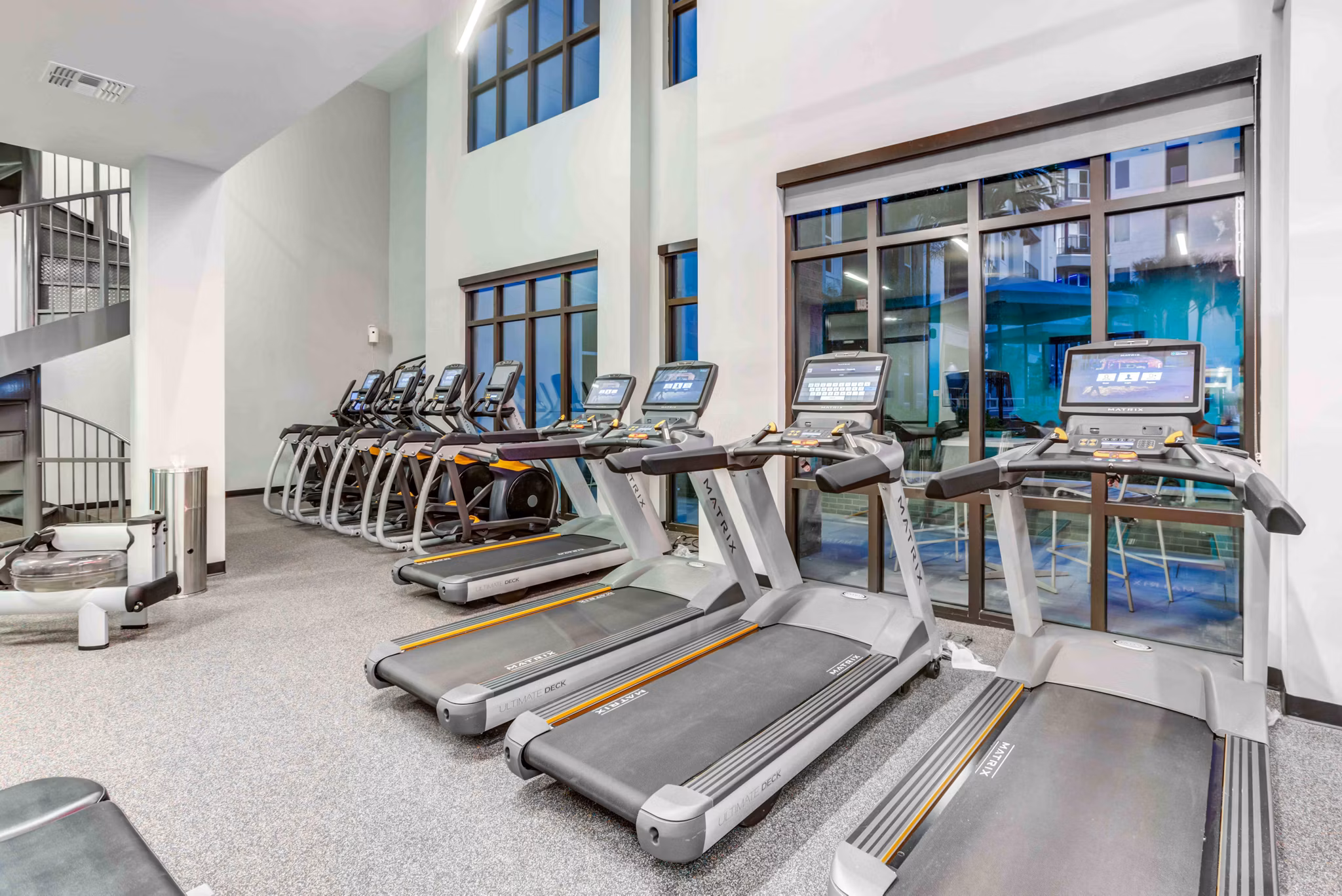 State-of-the-art fitness center with cardio machines at Union on Fletcher Apartments