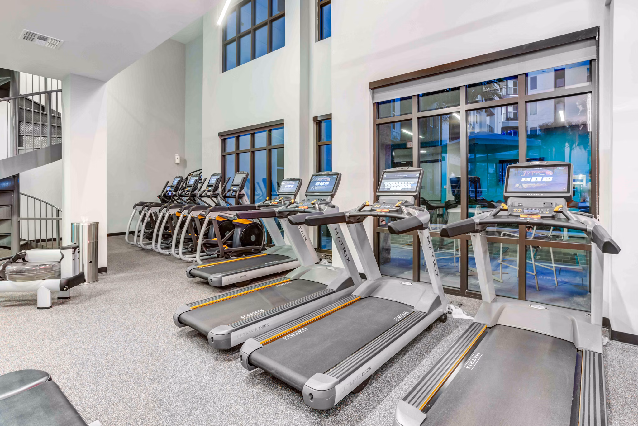 State-of-the-art fitness center with cardio machines at Union on Fletcher Apartments