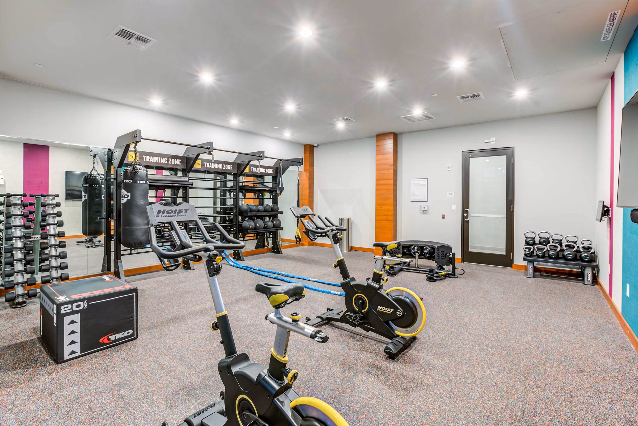 Modern fitness center with state-of-the-art equipment at Union on Fletcher Apartments, offering residents a comprehensive workout experience