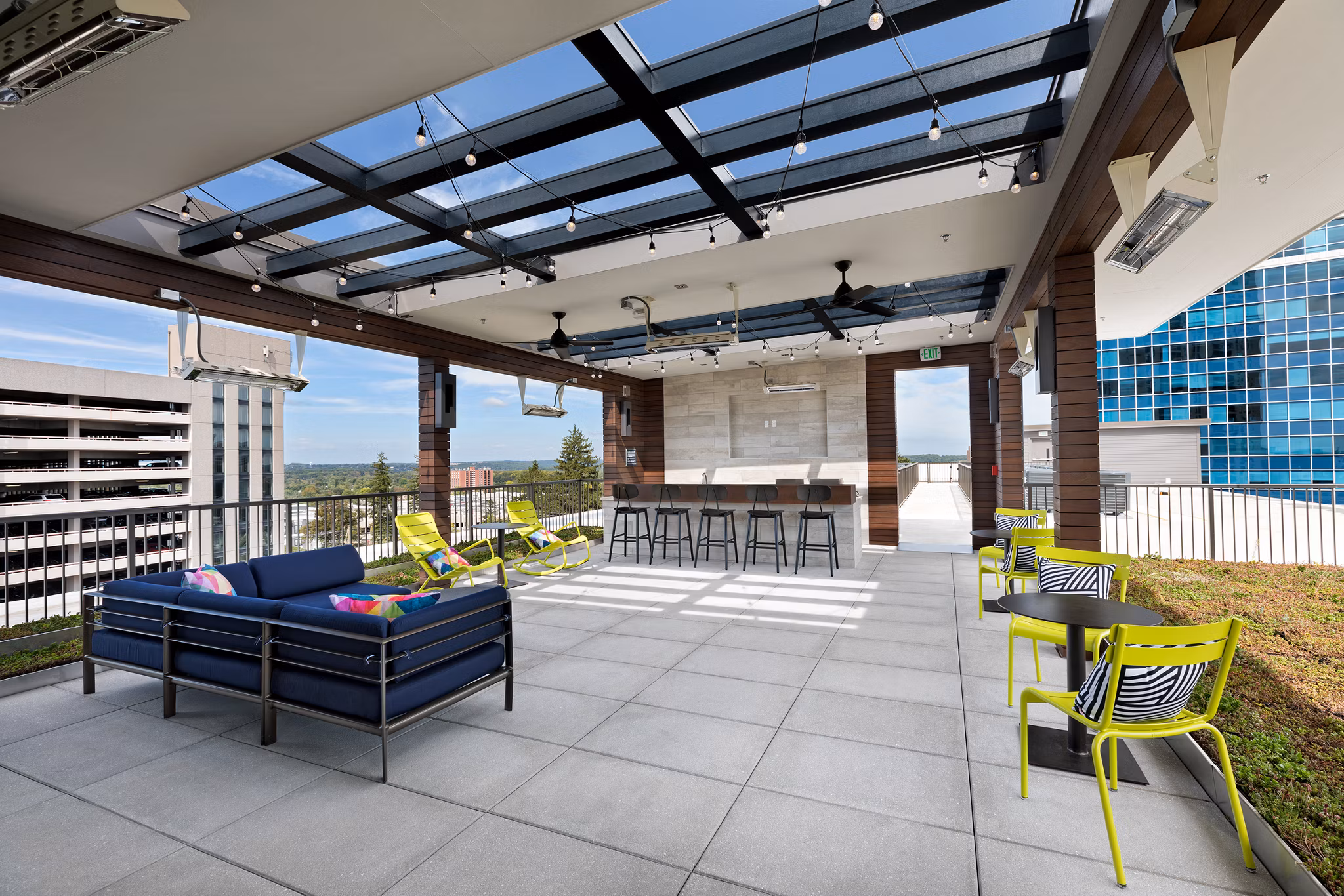 Relaxing rooftop deck with stunning views at Flats at 703 Apartments