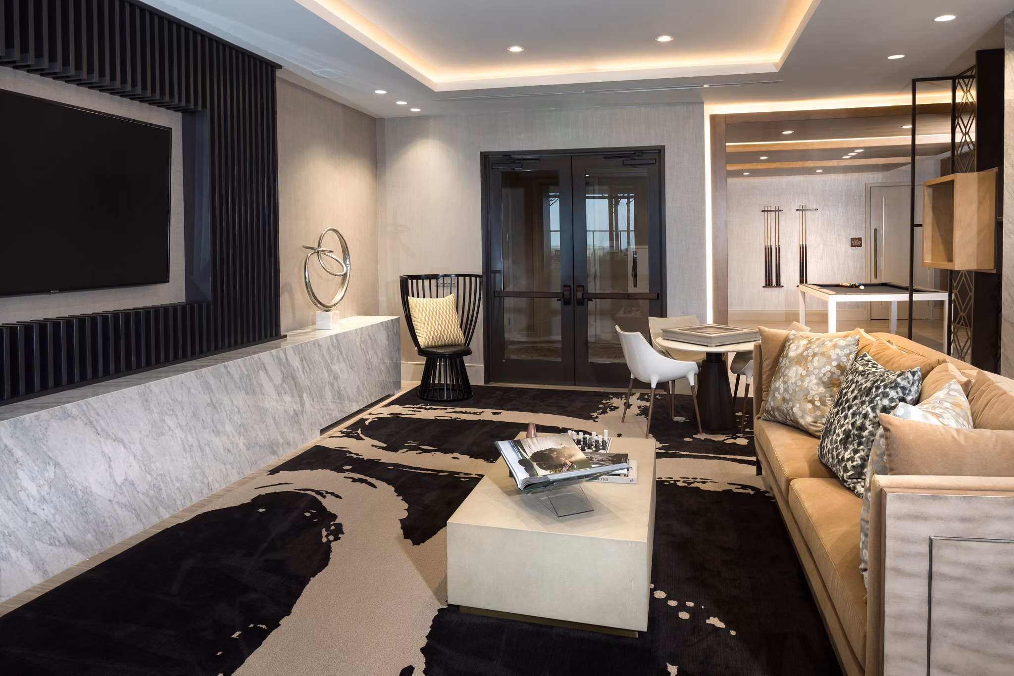 Clubhouse with modern seating and entertainment area at The Kincaid at Legacy Apartments