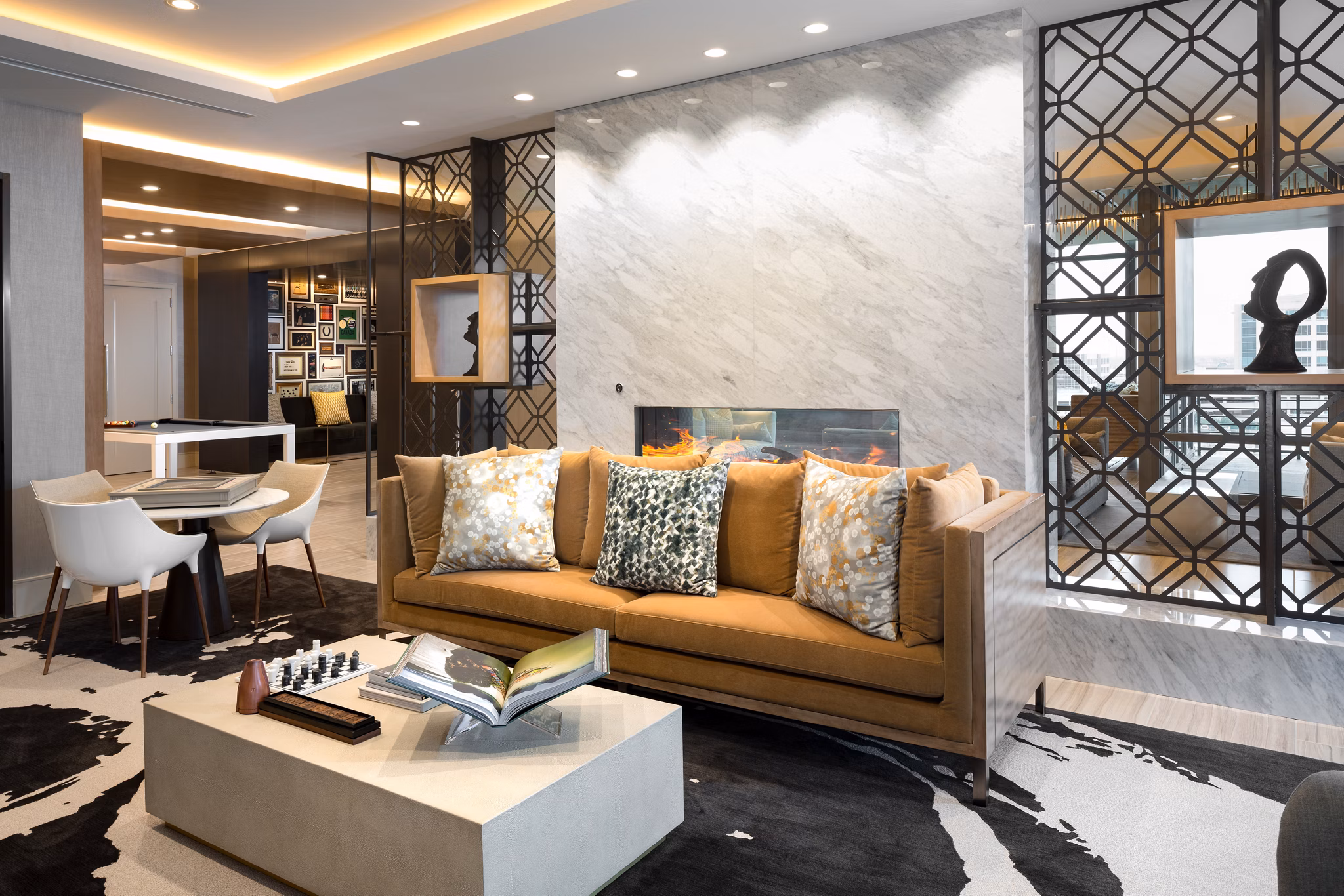 Clubhouse featuring modern design and cozy seating at The Kincaid at Legacy Apartments