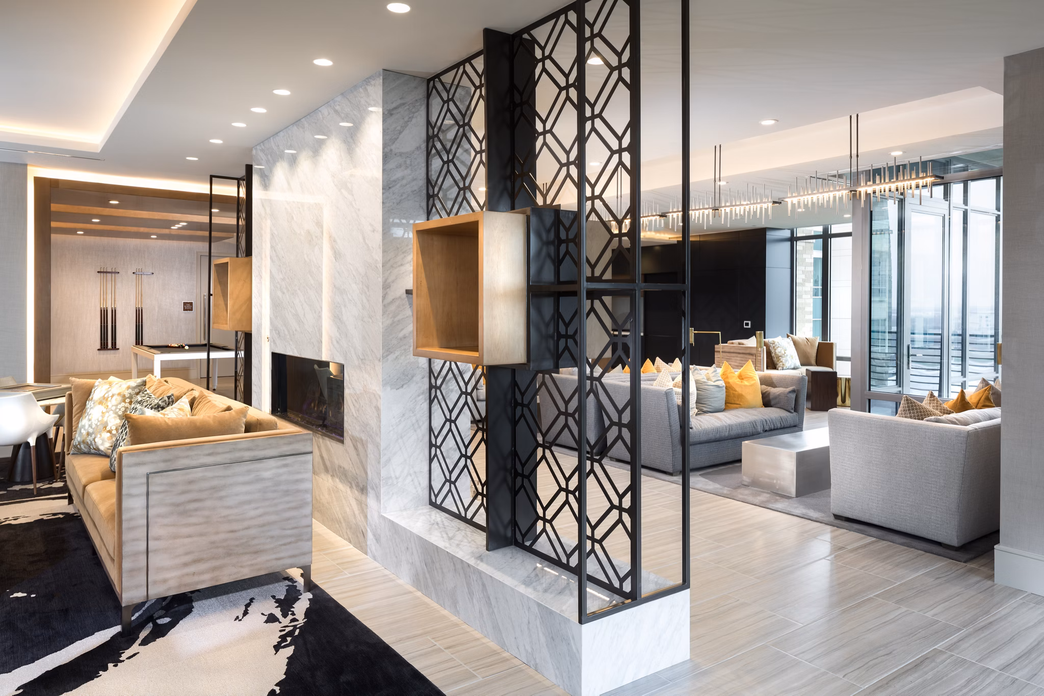 Clubhouse featuring modern design and cozy seating area at The Kincaid at Legacy Apartments