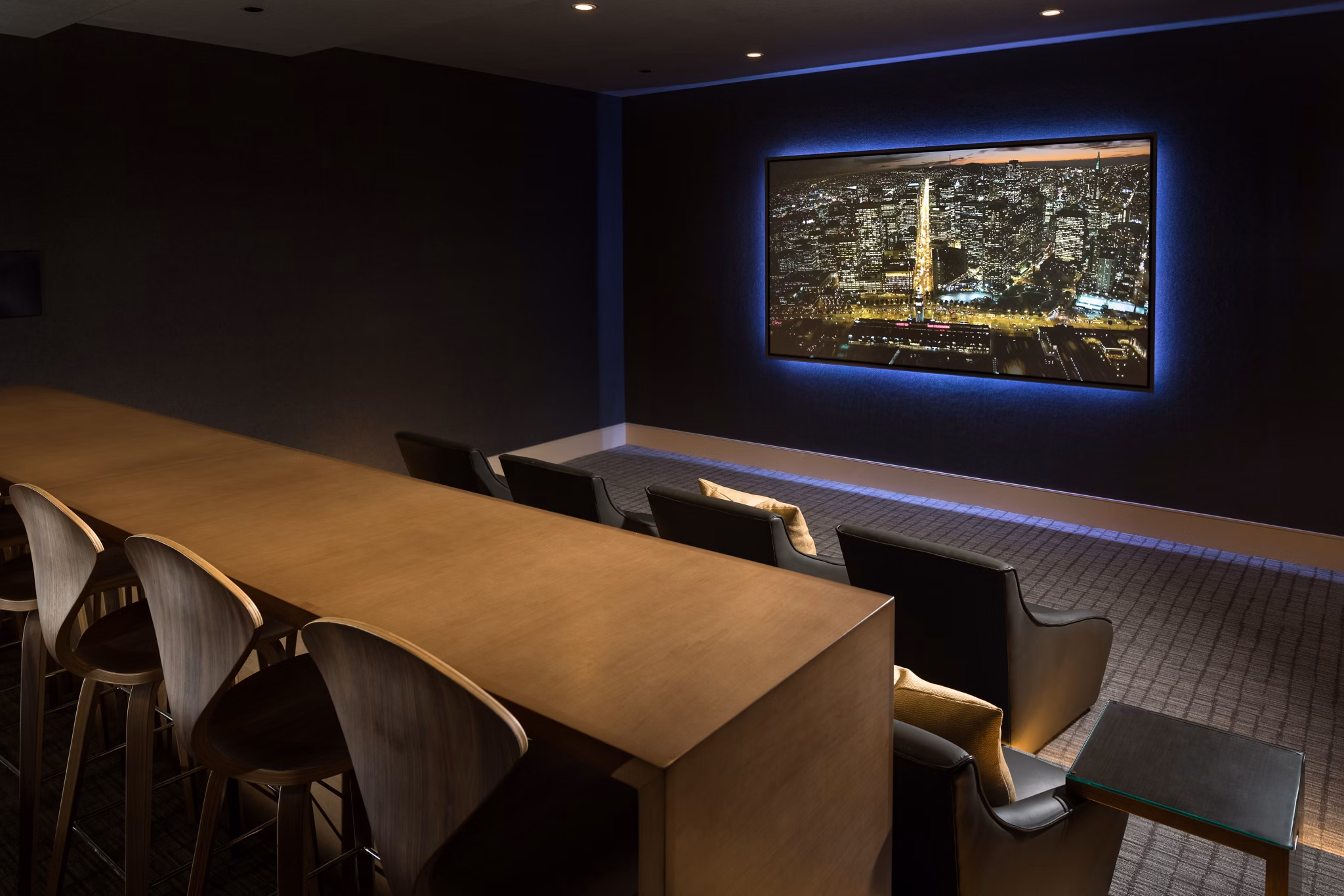 Theater room with plush seating and large screen at The Kincaid at Legacy Apartments, ideal for movie nights and luxury living experiences