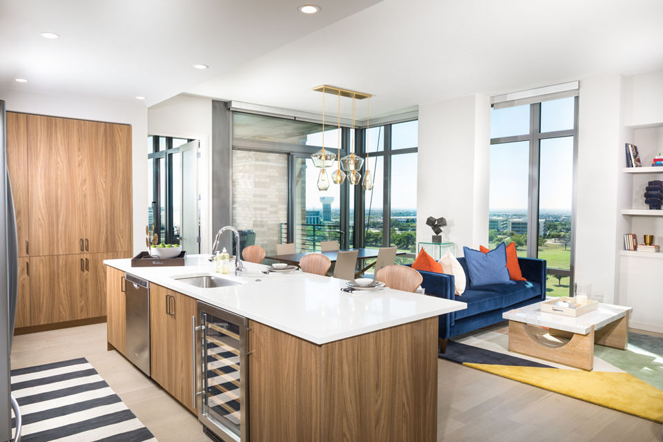 Spacious living room with contemporary decor and large windows in The Kincaid at Legacy Apartments, perfect for modern luxury living