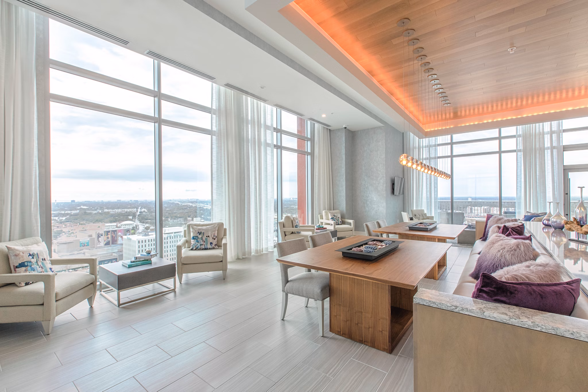 Clubhouse with modern decor and seating at Nine15 Apartments in downtown Tampa