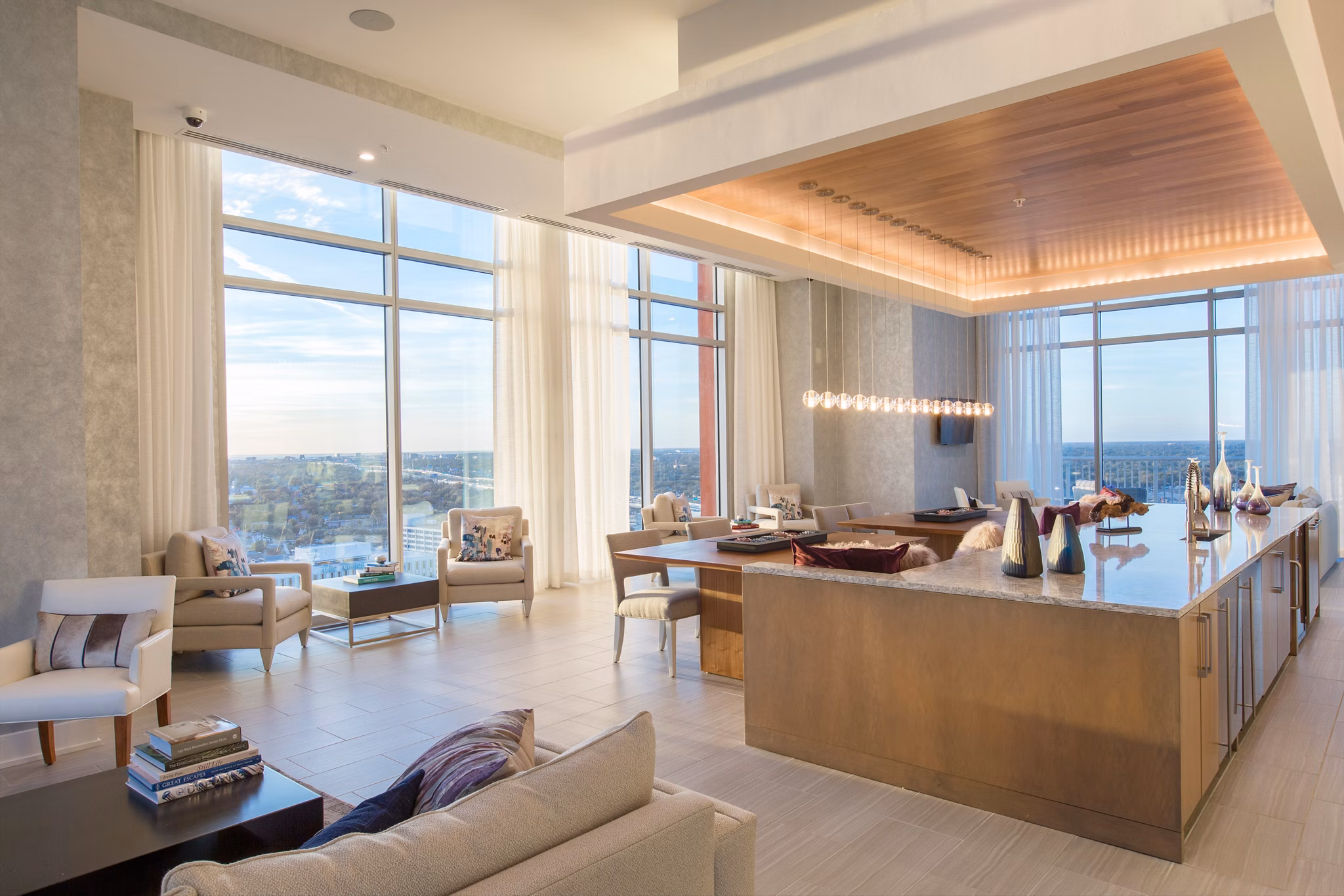 Clubhouse featuring modern lounge seating and billiards table at Nine15 Apartments