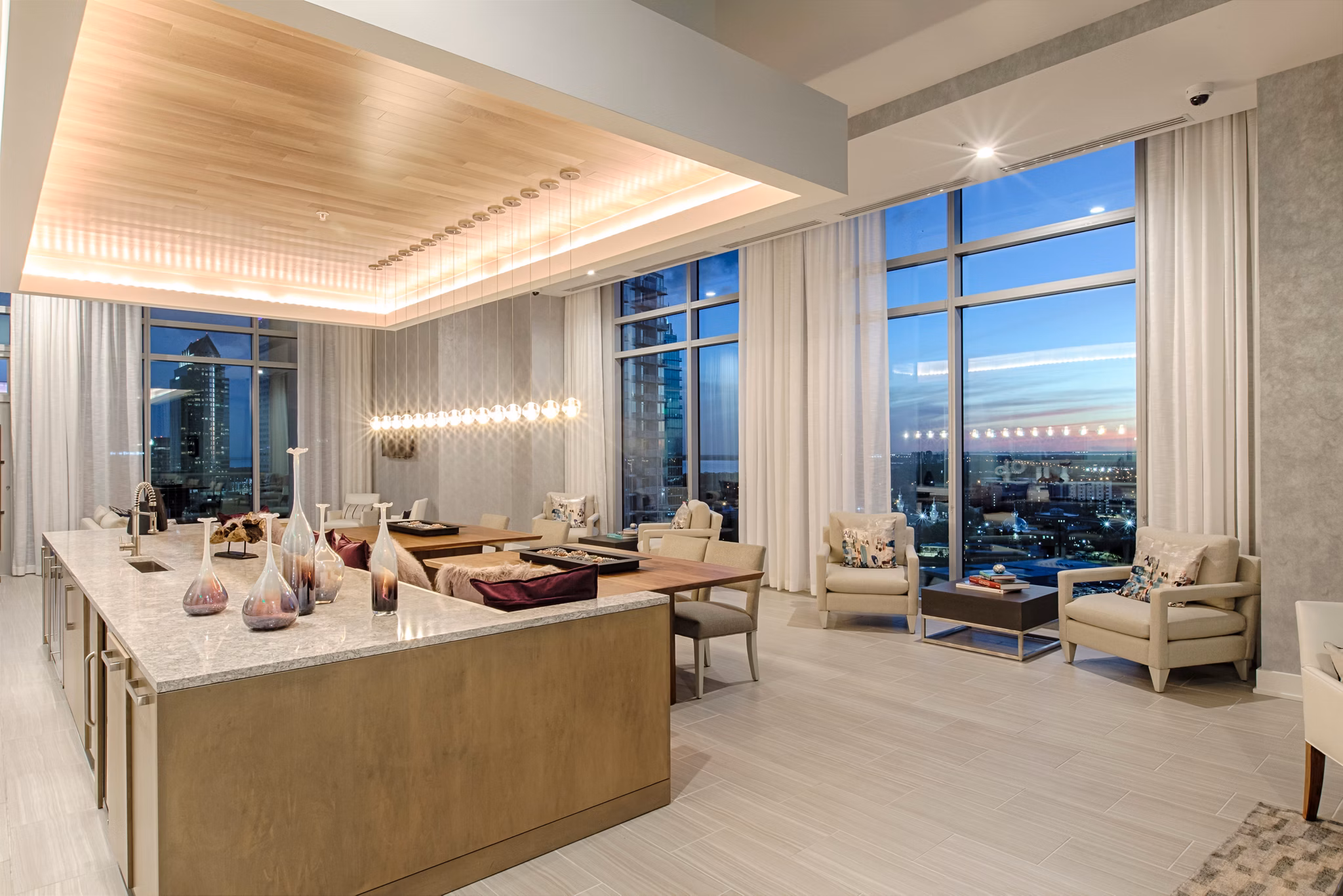 Spacious clubhouse with modern decor at Nine15 Apartments featuring comfortable seating and social areas