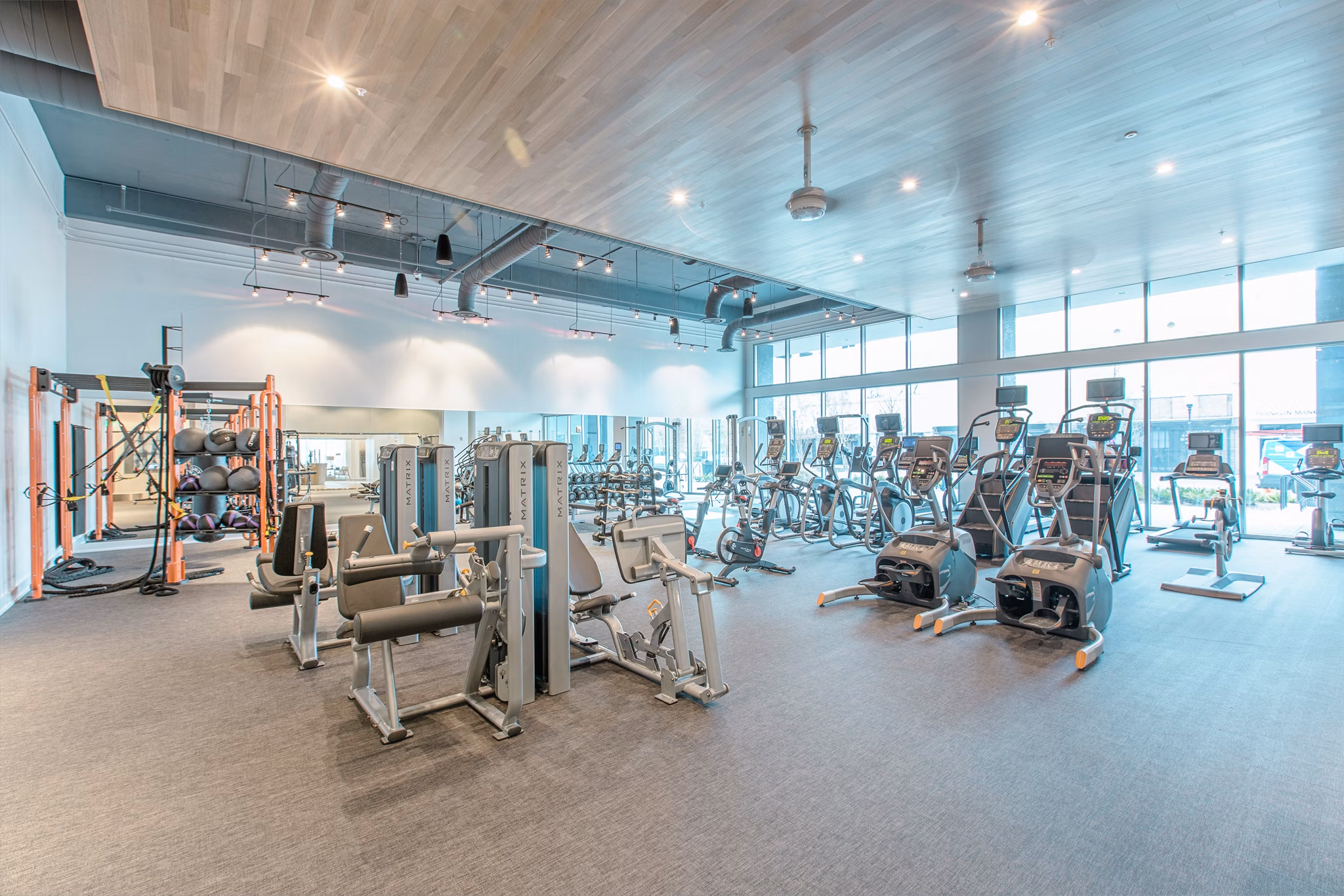 Modern fitness center with state-of-the-art equipment at Nine15 Apartments