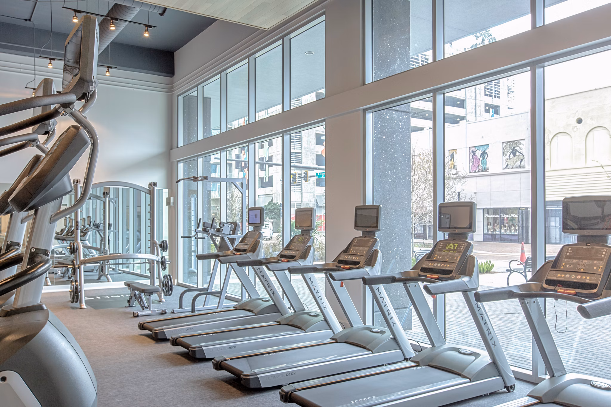 State-of-the-art fitness center at Nine15 Apartments featuring modern equipment and spacious workout areas