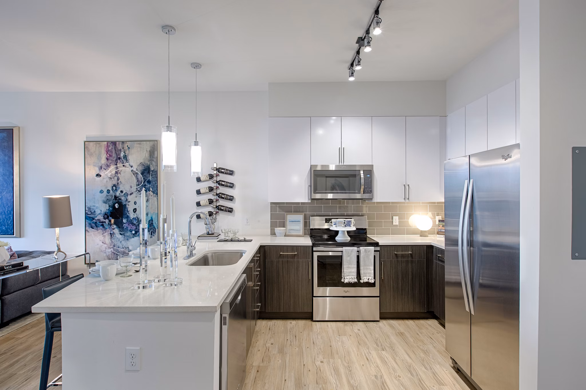 Modern kitchen featuring stainless steel appliances at Nine15 Apartments