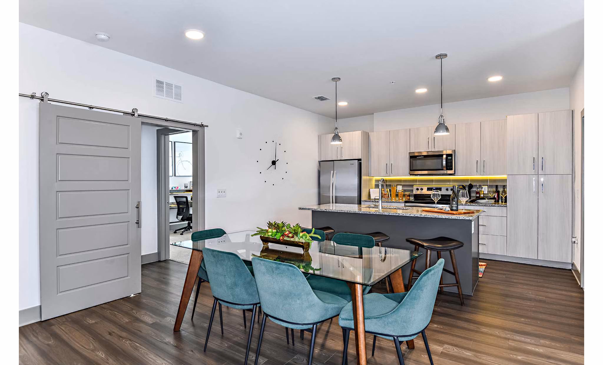 Dining area with modern furnishings and natural light at The Jamison Apartments