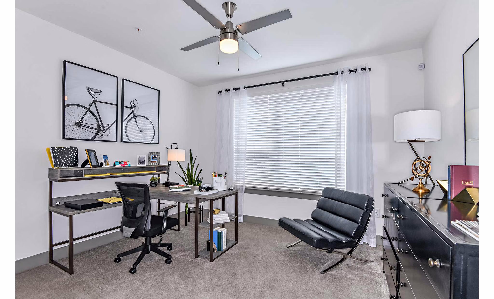 Modern kitchen with sleek appliances and breakfast bar in The Jamison Apartments