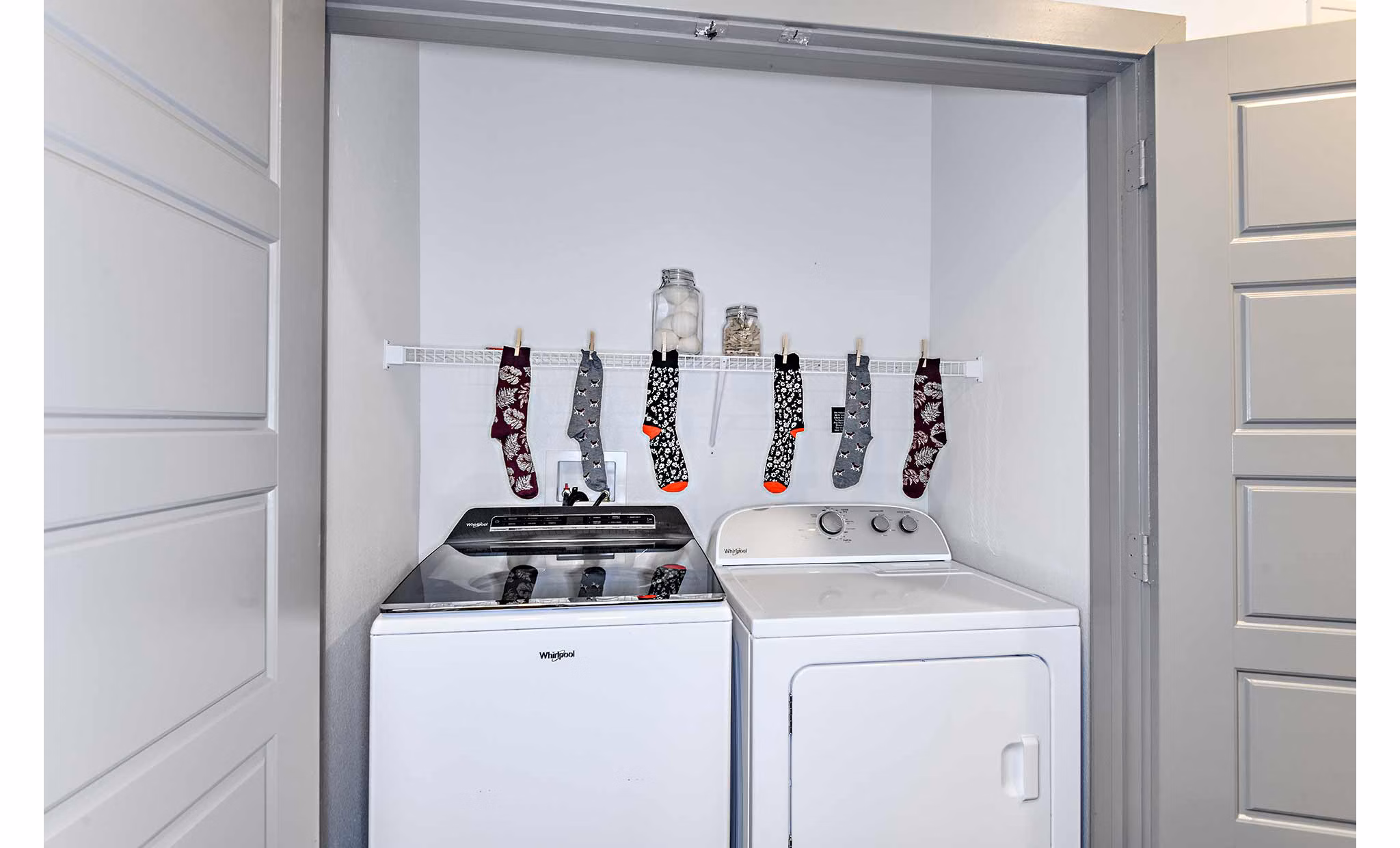 Laundry room with state-of-the-art washers and dryers at The Jamison Apartments