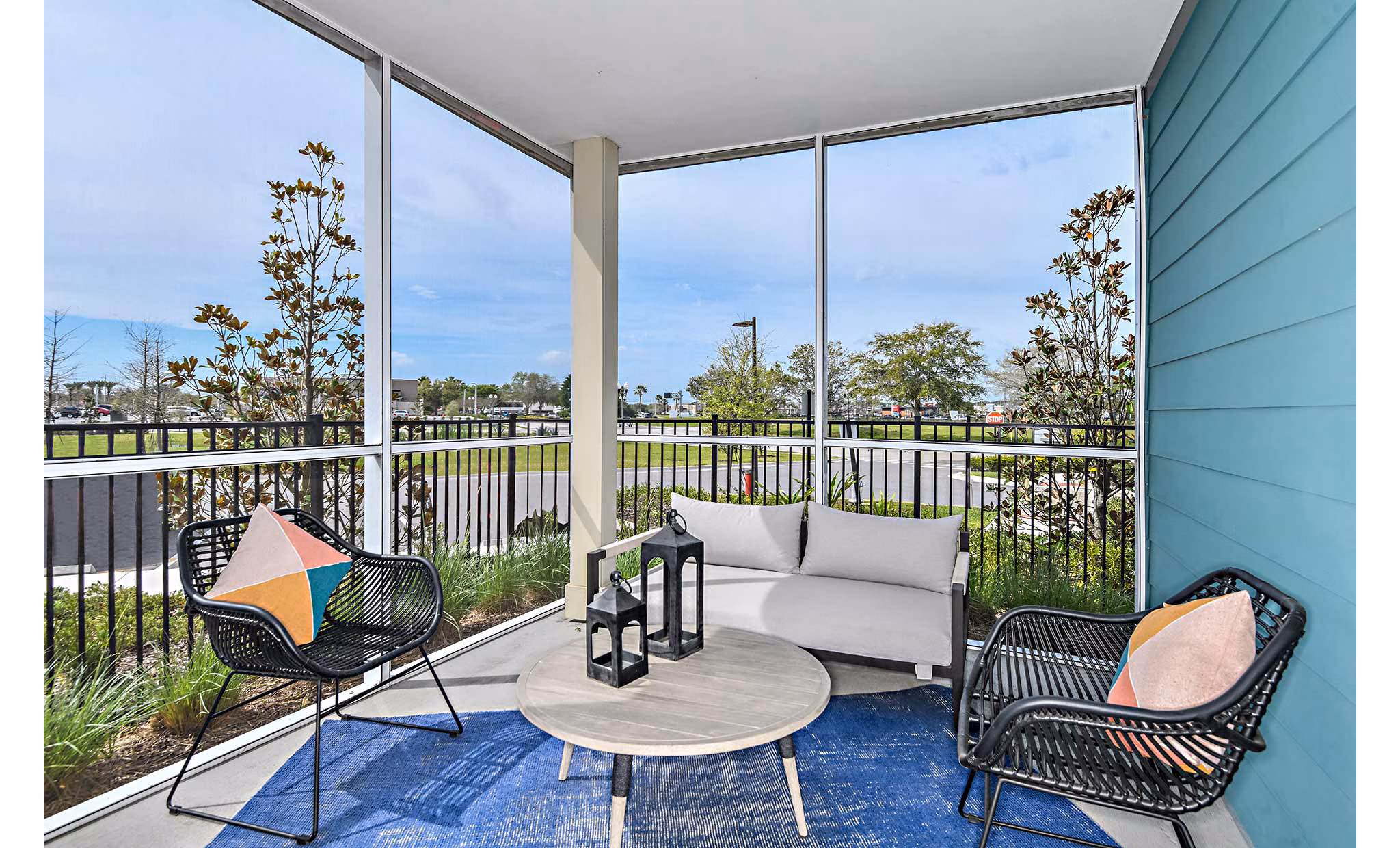 Cozy patio space featuring comfortable seating at The Jamison Apartments