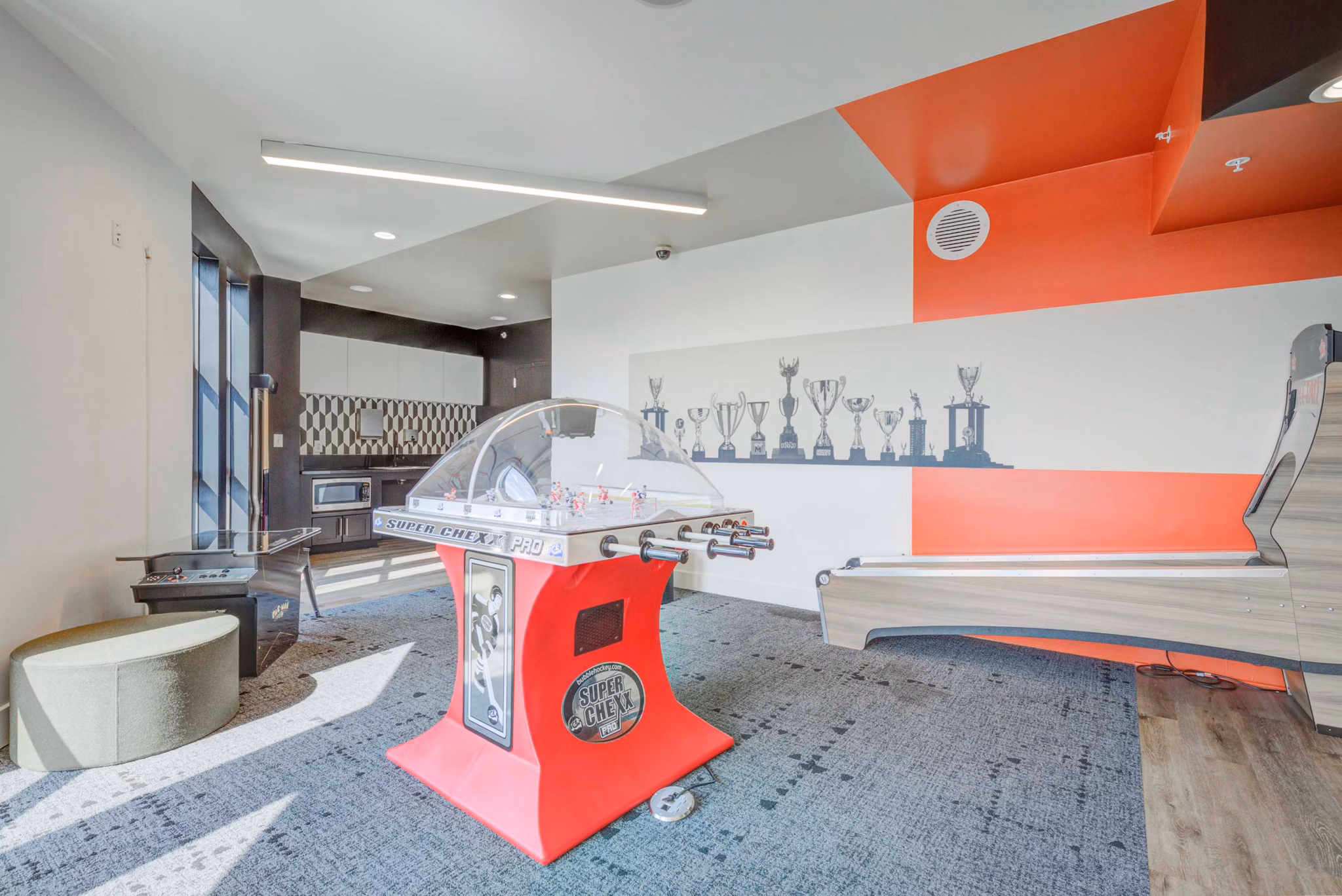 Game room featuring billiards and entertainment zone at The Varsity Apartments, a luxury student living community