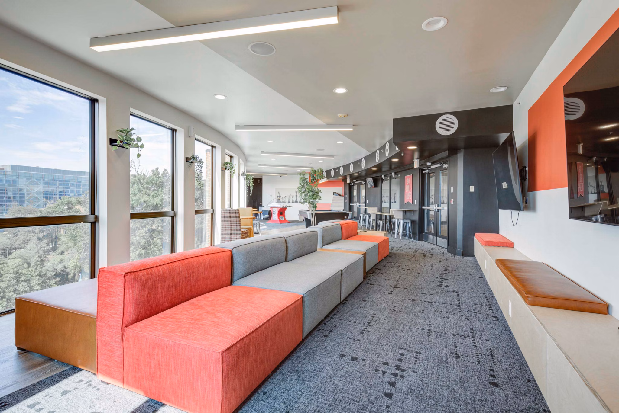 Modern fitness center featuring state-of-the-art equipment at The Varsity Apartments clubhouse