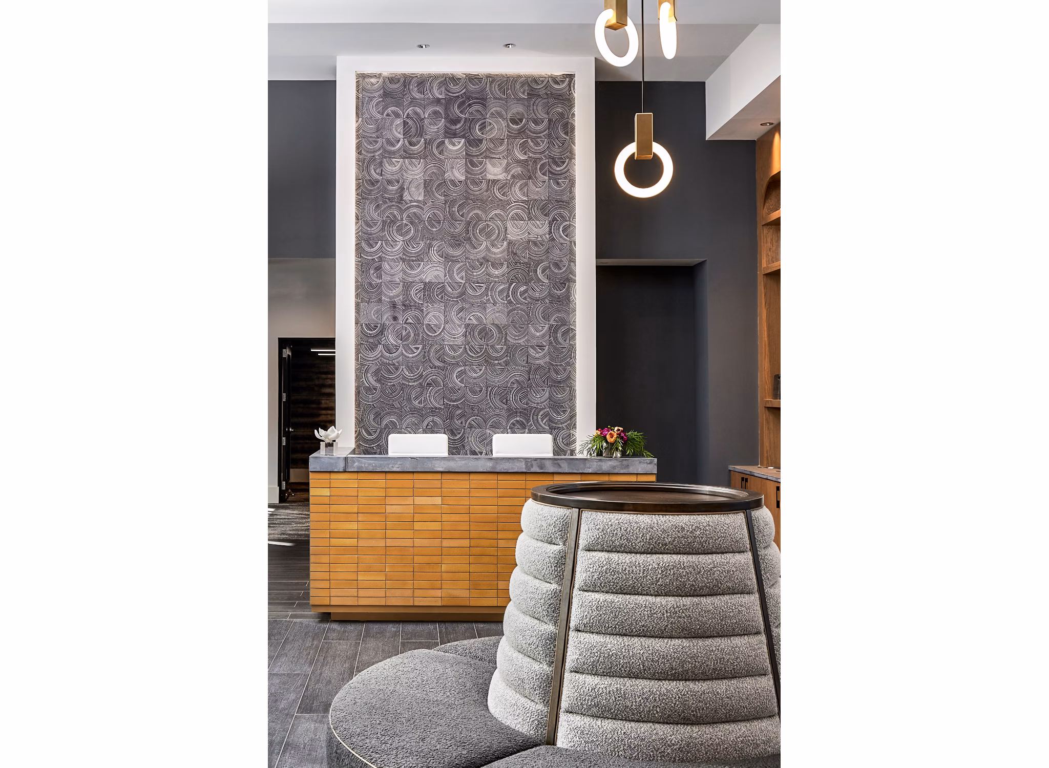 Clubhouse lobby with stylish seating and modern decor at The Court at Redstone Apartments