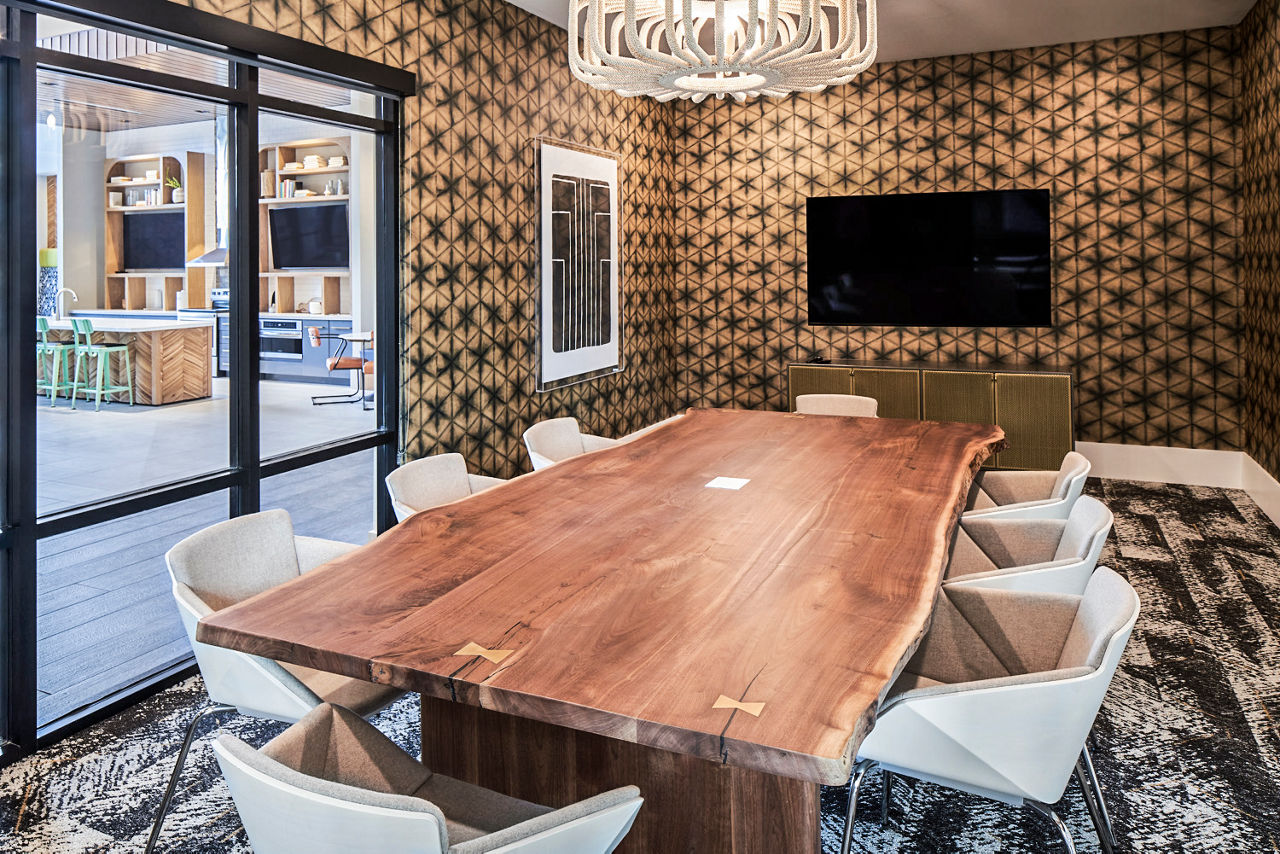 Clubhouse meeting facility with modern design at The Court at Redstone Apartments, Greystar luxury apartments in a vibrant community