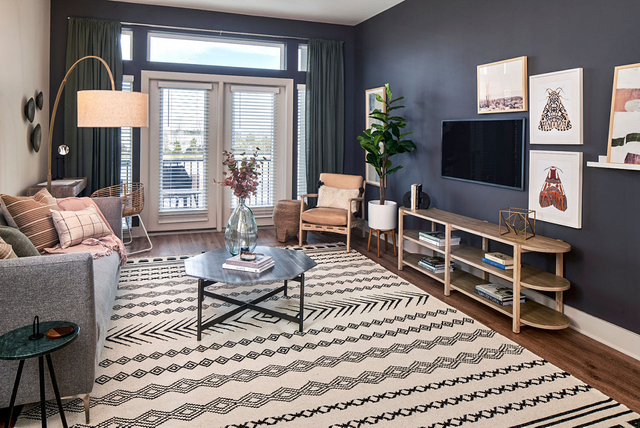 Modern living room with sleek furnishings at The Court at Redstone Apartments