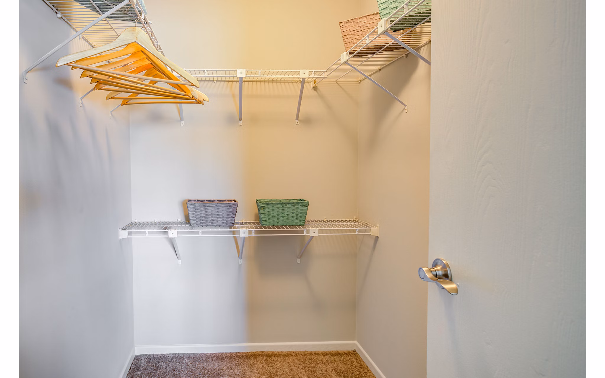 Walk-in closet with built-in shelving at Orion Arlington Lakes Apartments