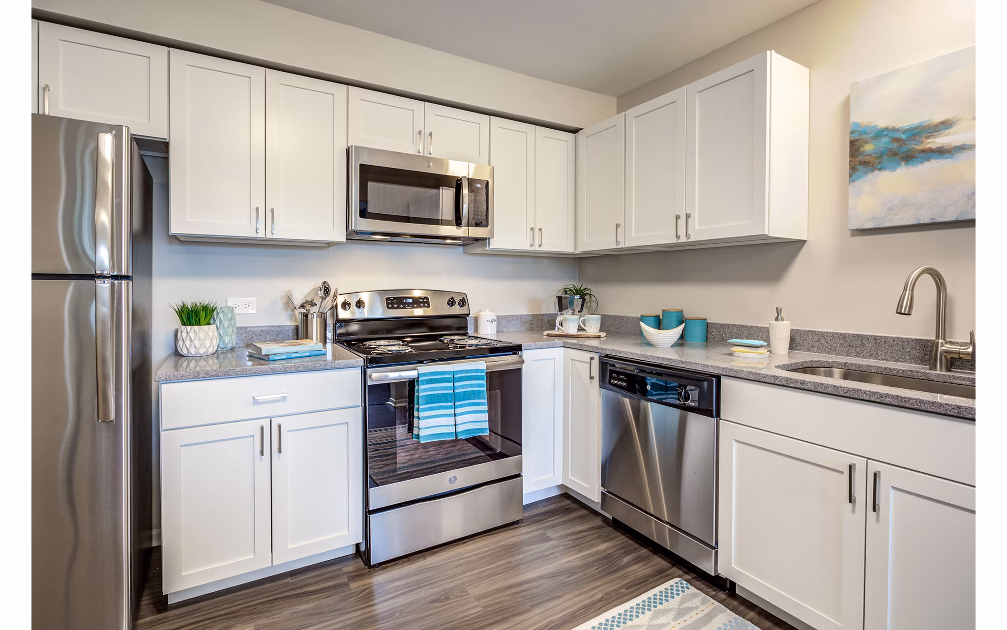 Modern kitchen with stainless steel appliances at Orion Arlington Lakes Apartments