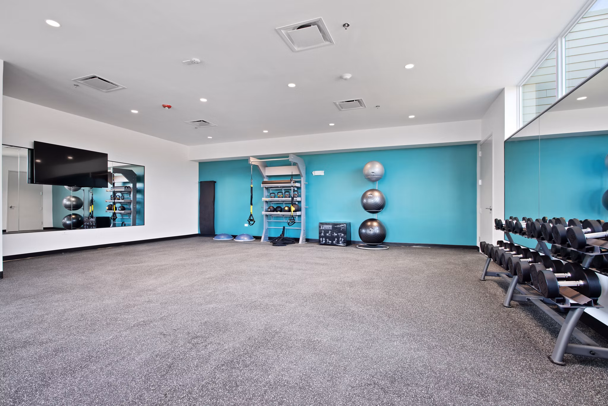 Fitness center at Orion Parkview Apartments featuring state-of-the-art equipment and space for workouts