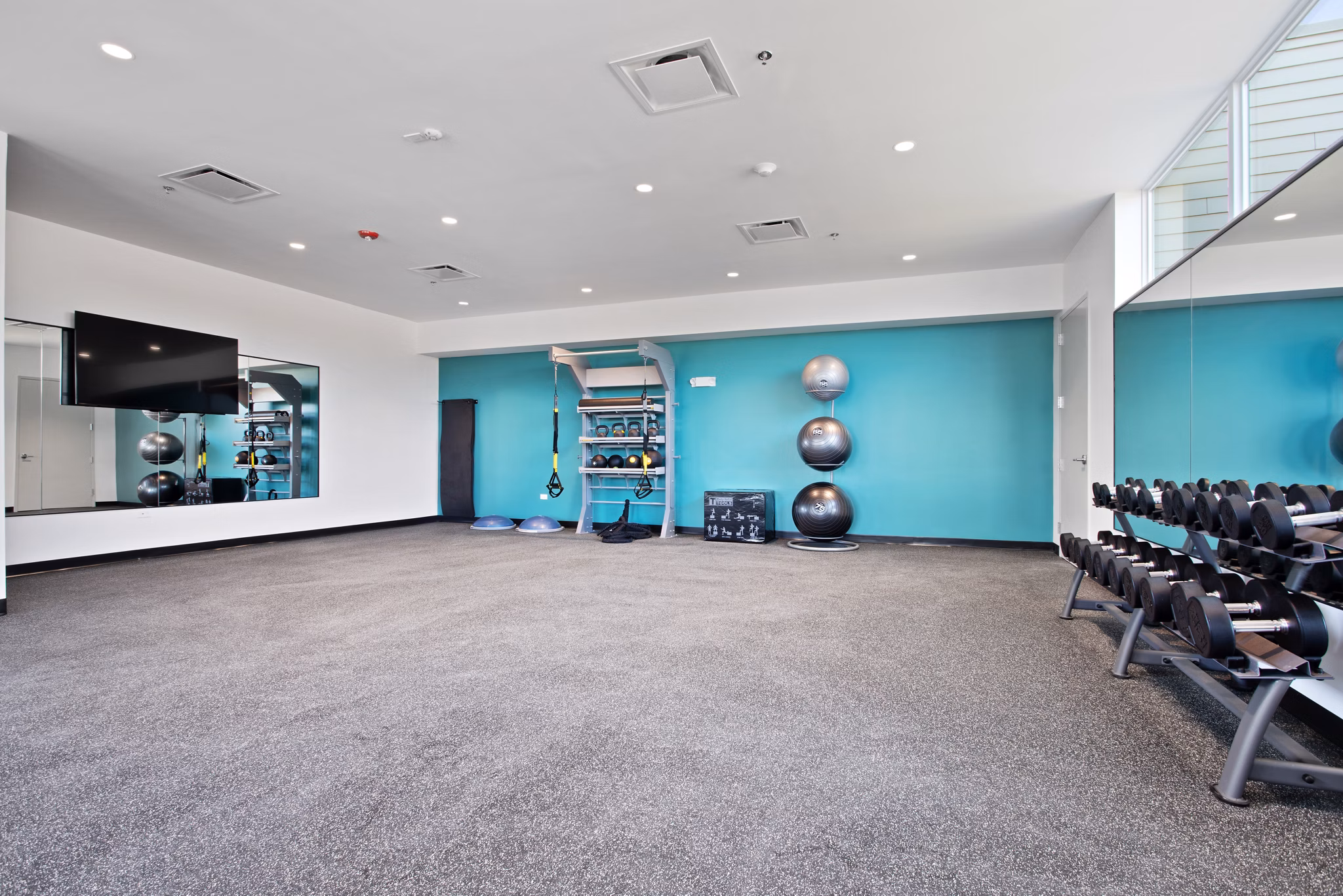 Fitness center at Orion Parkview Apartments featuring state-of-the-art equipment and space for workouts