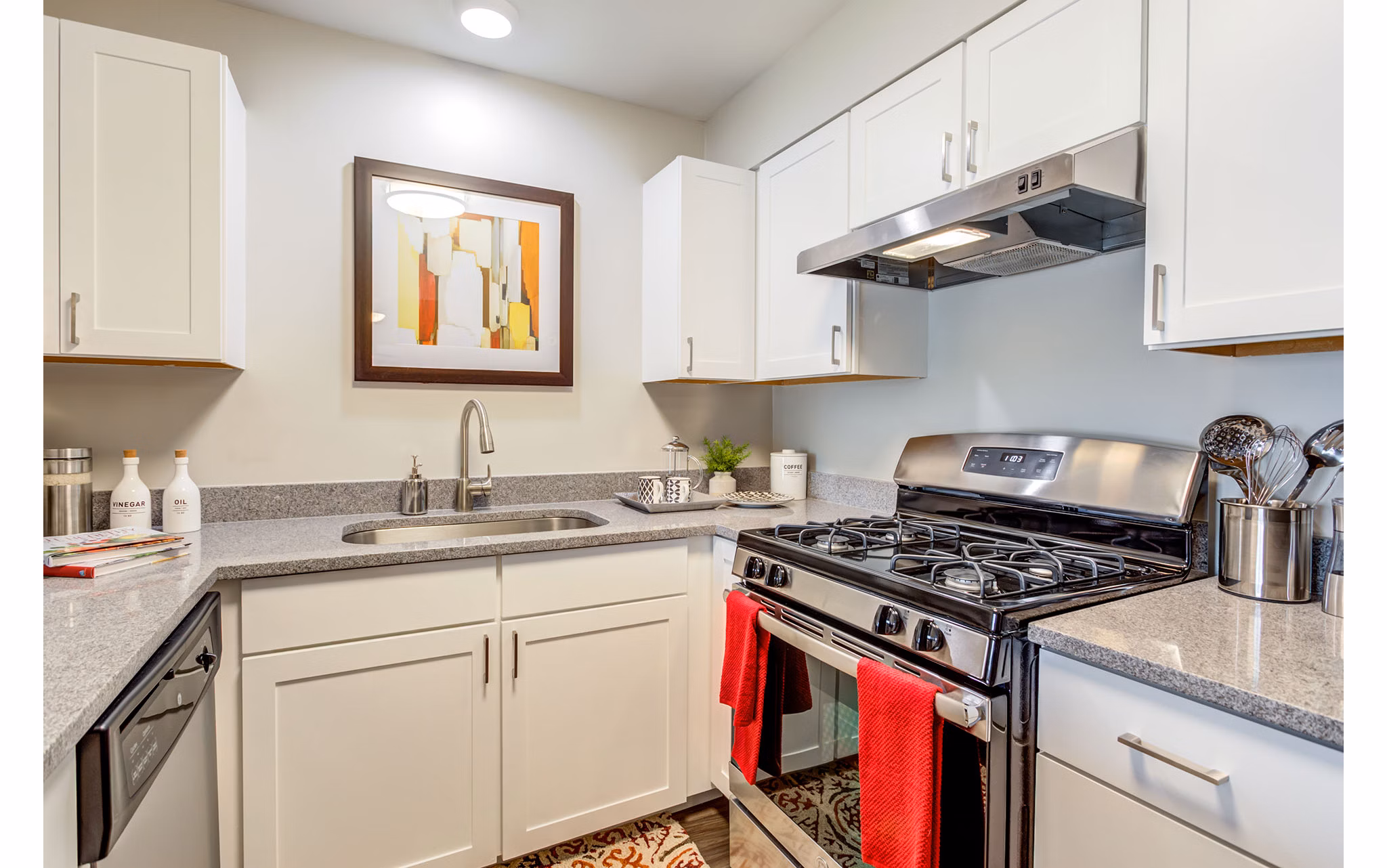 Modern kitchen with stainless steel appliances and island in Orion Parkview Apartments