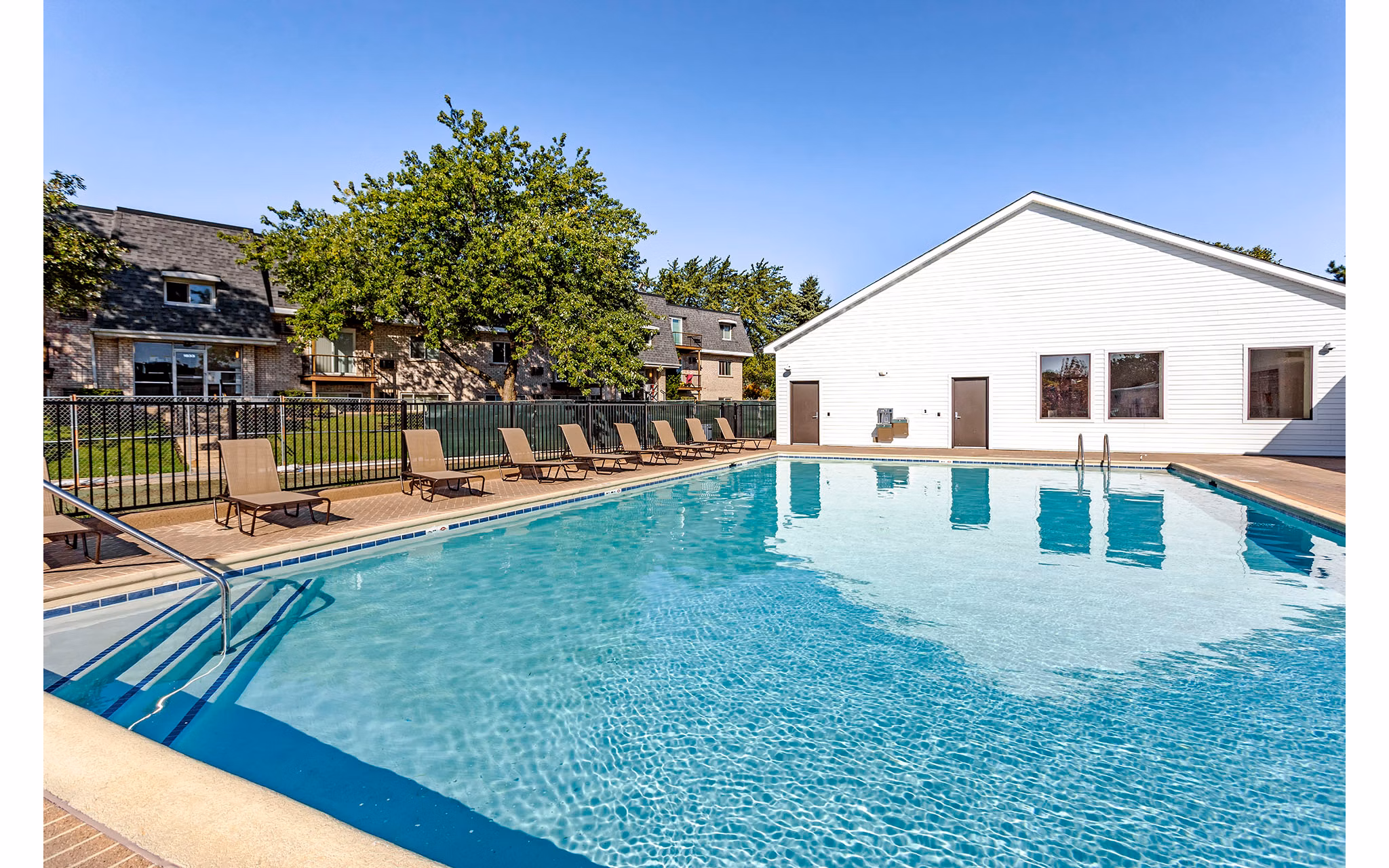 Relaxing pool area with lounge chairs at Orion Parkview Apartments, offering a serene escape in a luxury apartment community