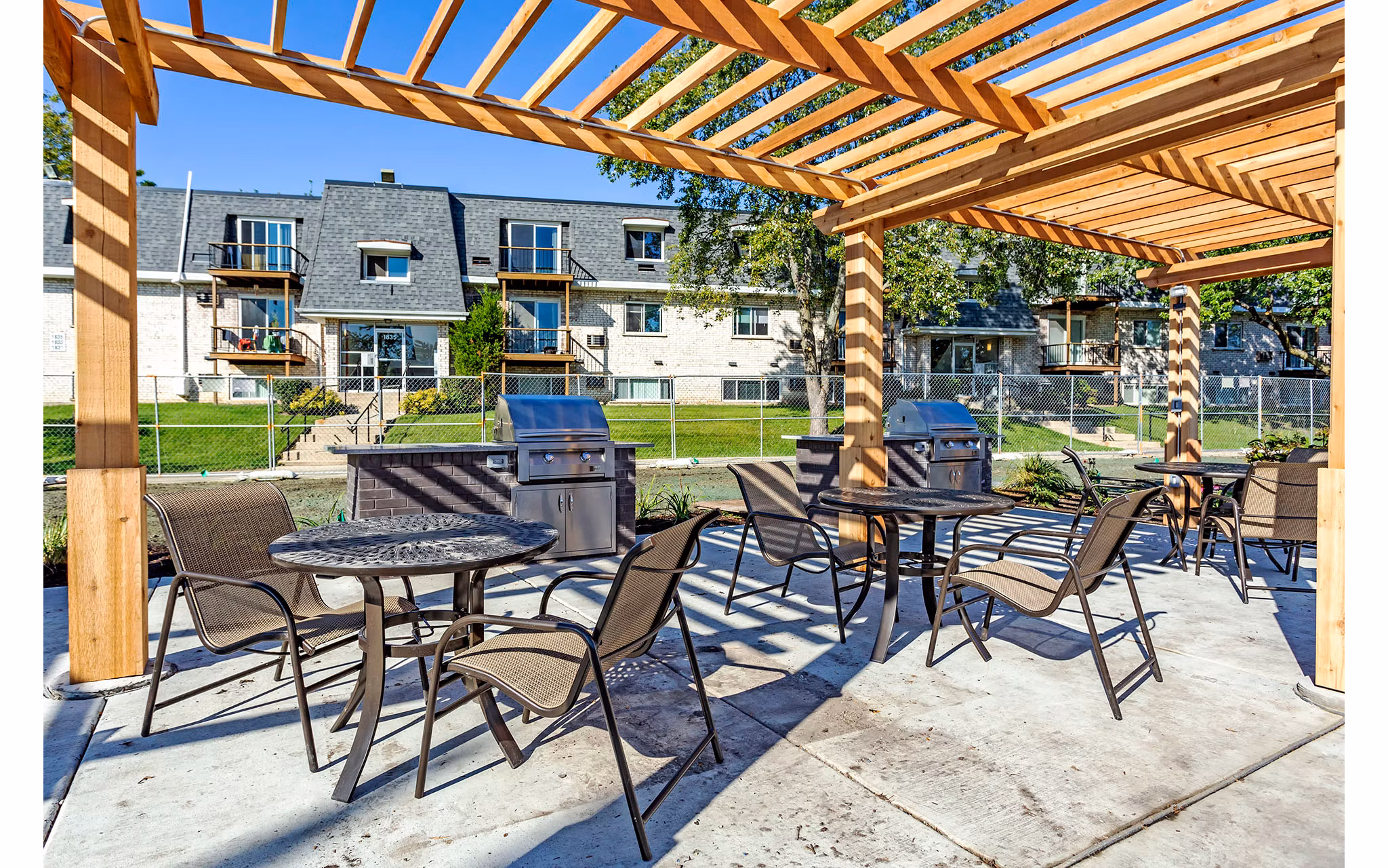 Modern grill area with comfortable seating at Orion Parkview Apartments, perfect for outdoor gatherings and relaxation in a luxury setting