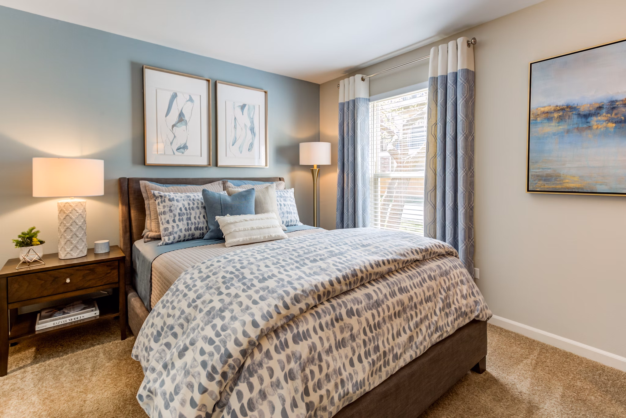 Modern bedroom with neutral tones and ample natural light at Orion Prospect Apartments
