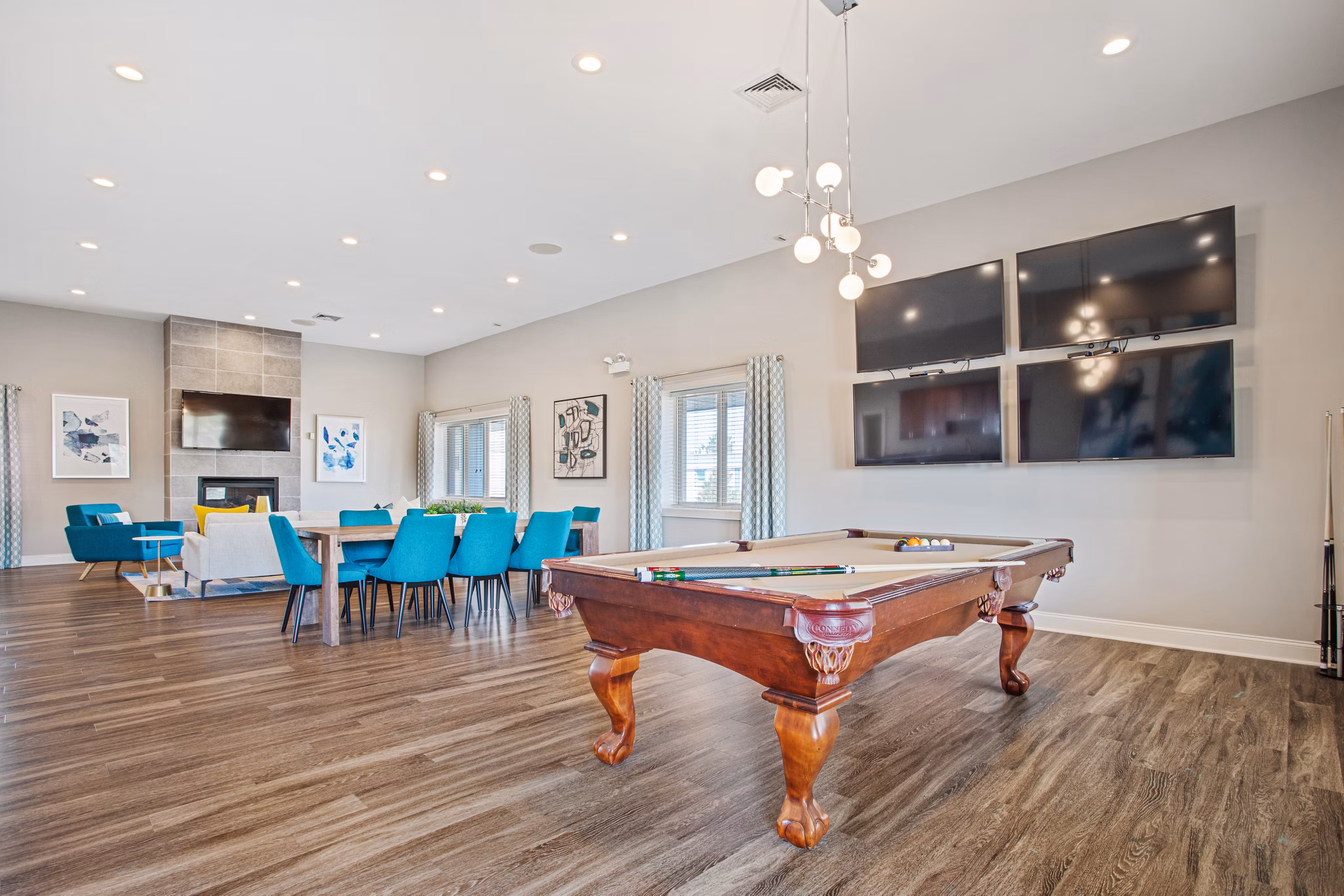 Clubhouse with modern furnishings and open layout at Orion Prospect Apartments