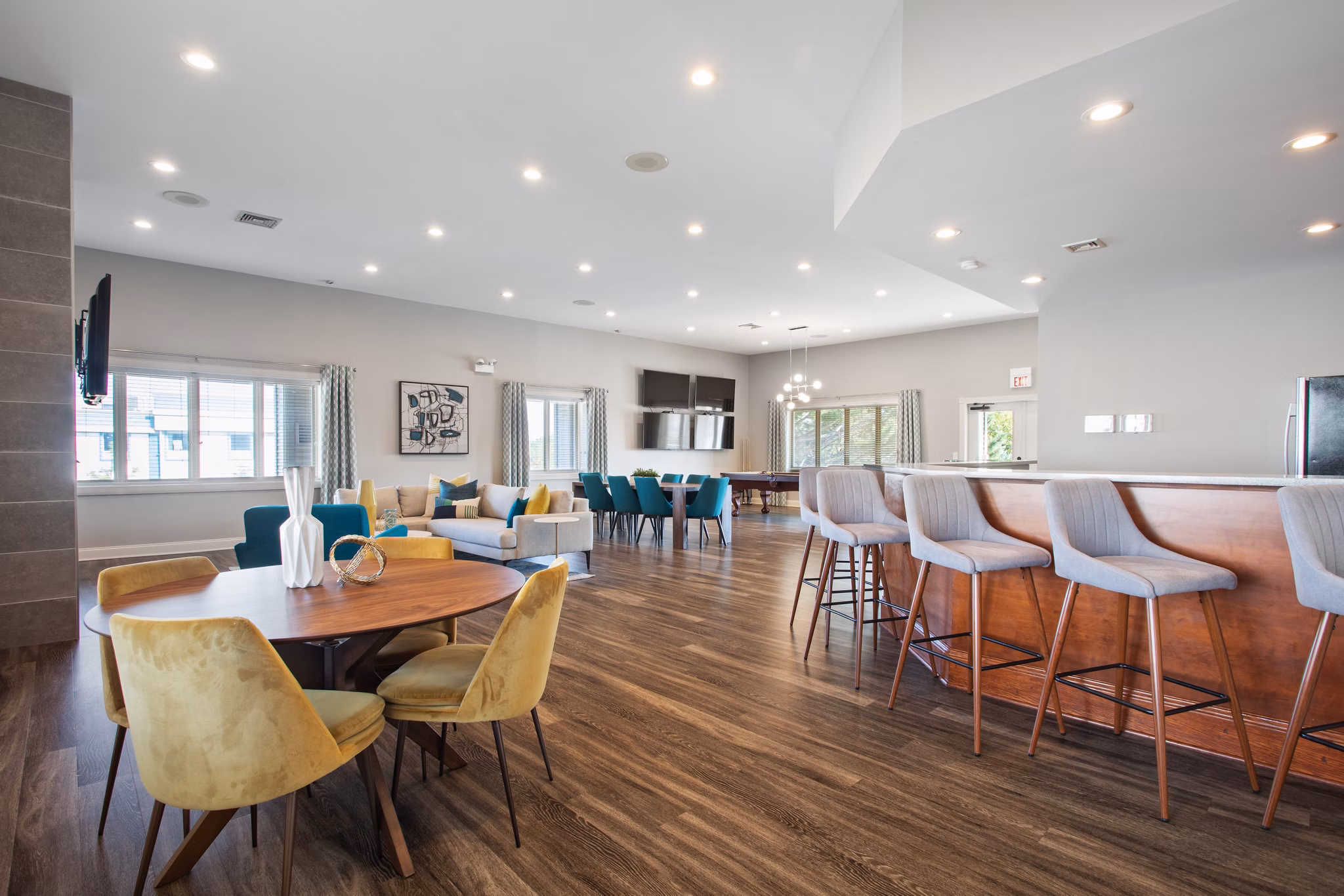 Modern clubhouse featuring a stylish lounge area at Orion Prospect Apartments, ideal for community events and gatherings