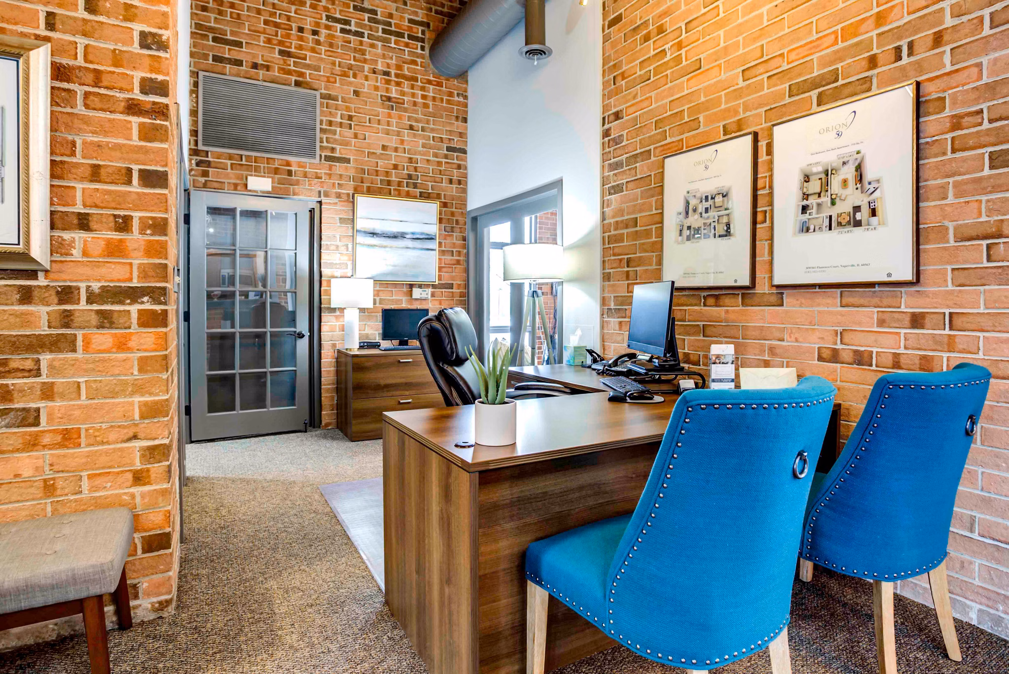 Clubhouse with modern design and comfortable seating at Orion 59 Apartments