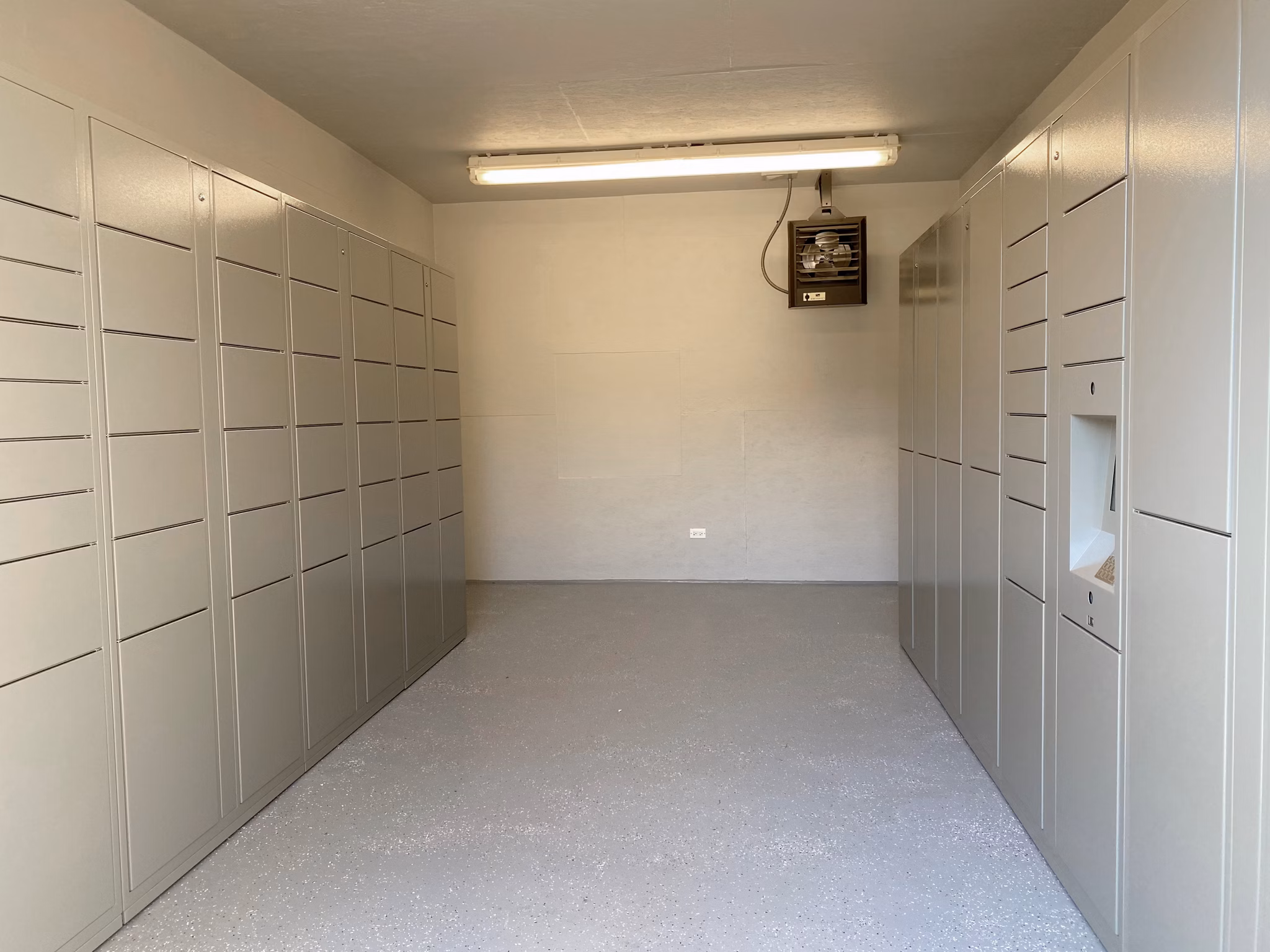 Mailroom at Orion 59 Apartments: Modern and efficient mail sorting area for residents