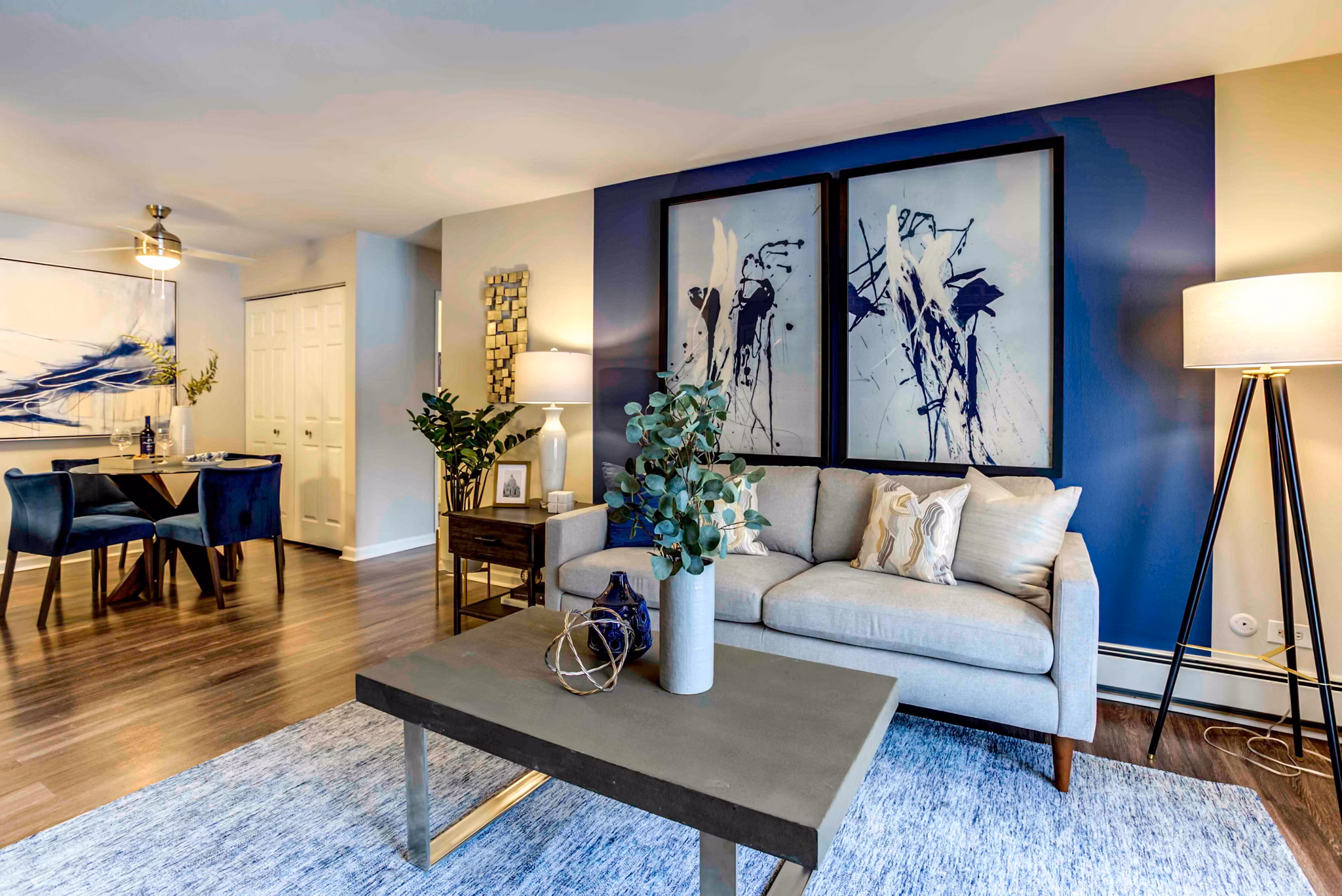 Spacious living room with modern decor at Orion 59 Apartments