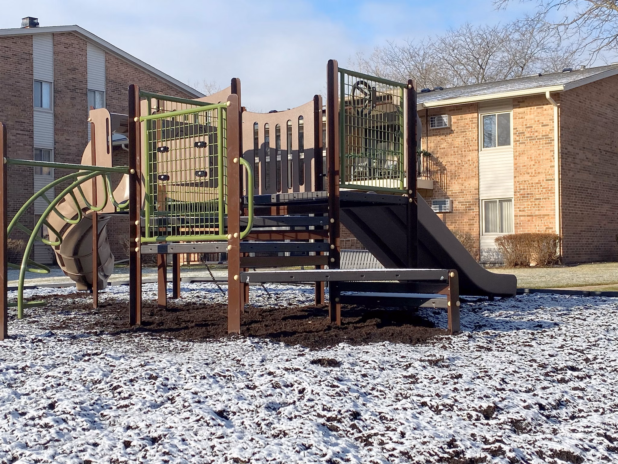 Colorful playground with modern equipment at Orion 59 Apartments, offering family-friendly amenities for residents