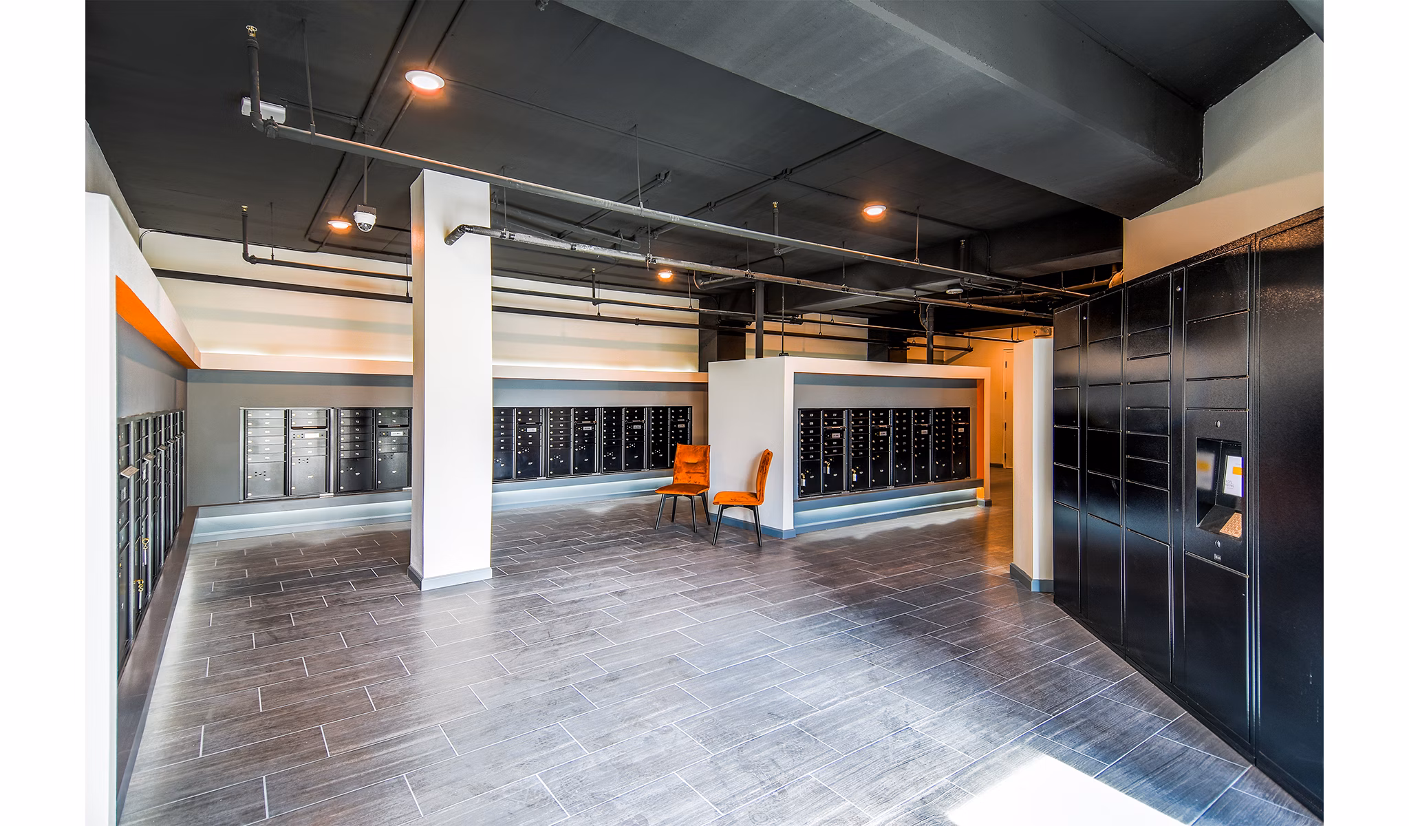 Sanctuary at Centerpointe Apartments: Modern mail room with parcel lockers