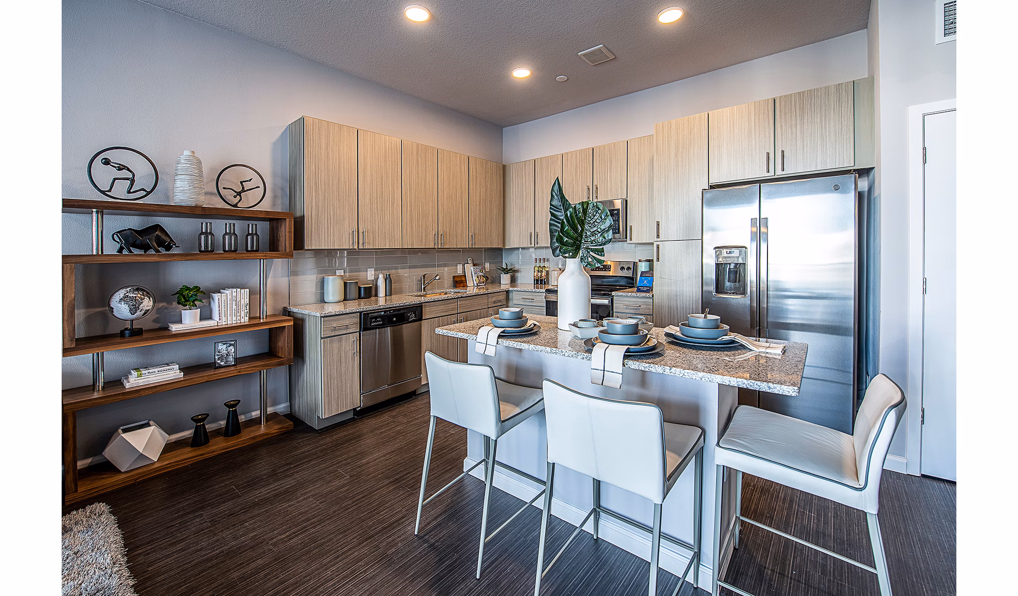 Modern kitchen with stainless steel appliances at Sanctuary at Centerpointe Apartments
