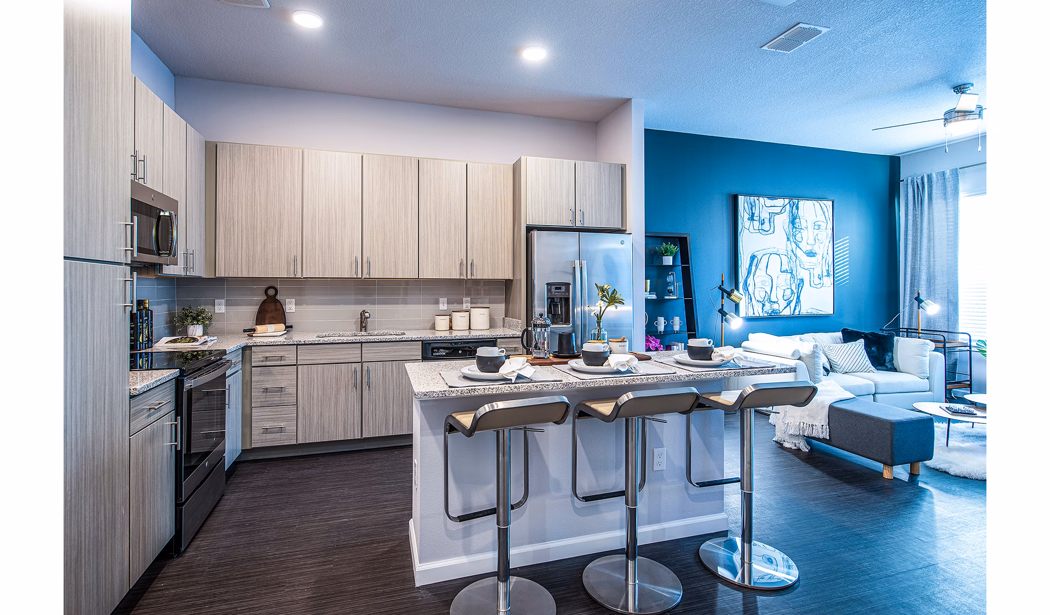 Modern kitchen with stainless steel appliances at Sanctuary at Centerpointe Apartments