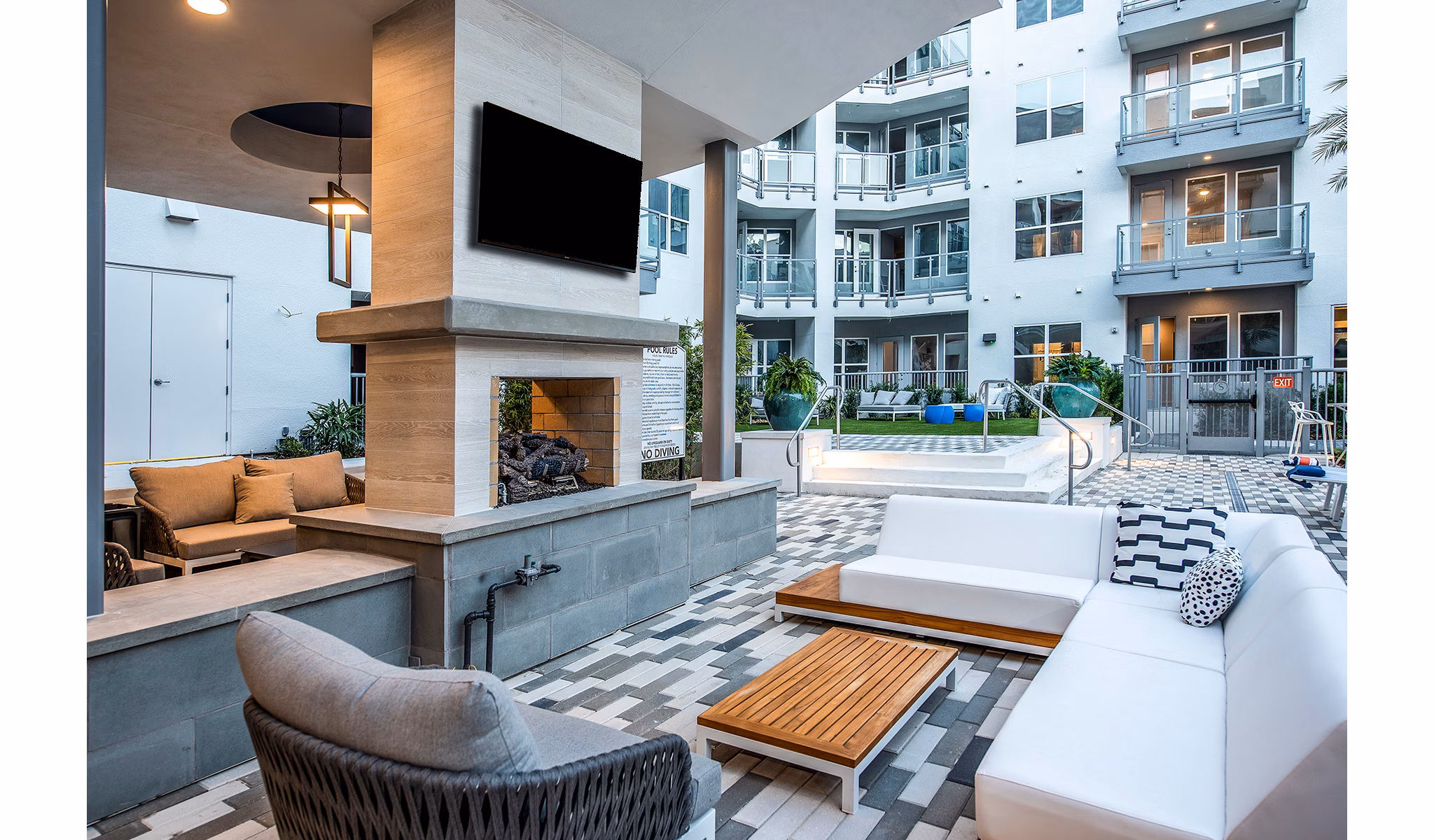 Sanctuary at Centerpointe: Cozy patio with fire pit area for relaxation in luxury apartments