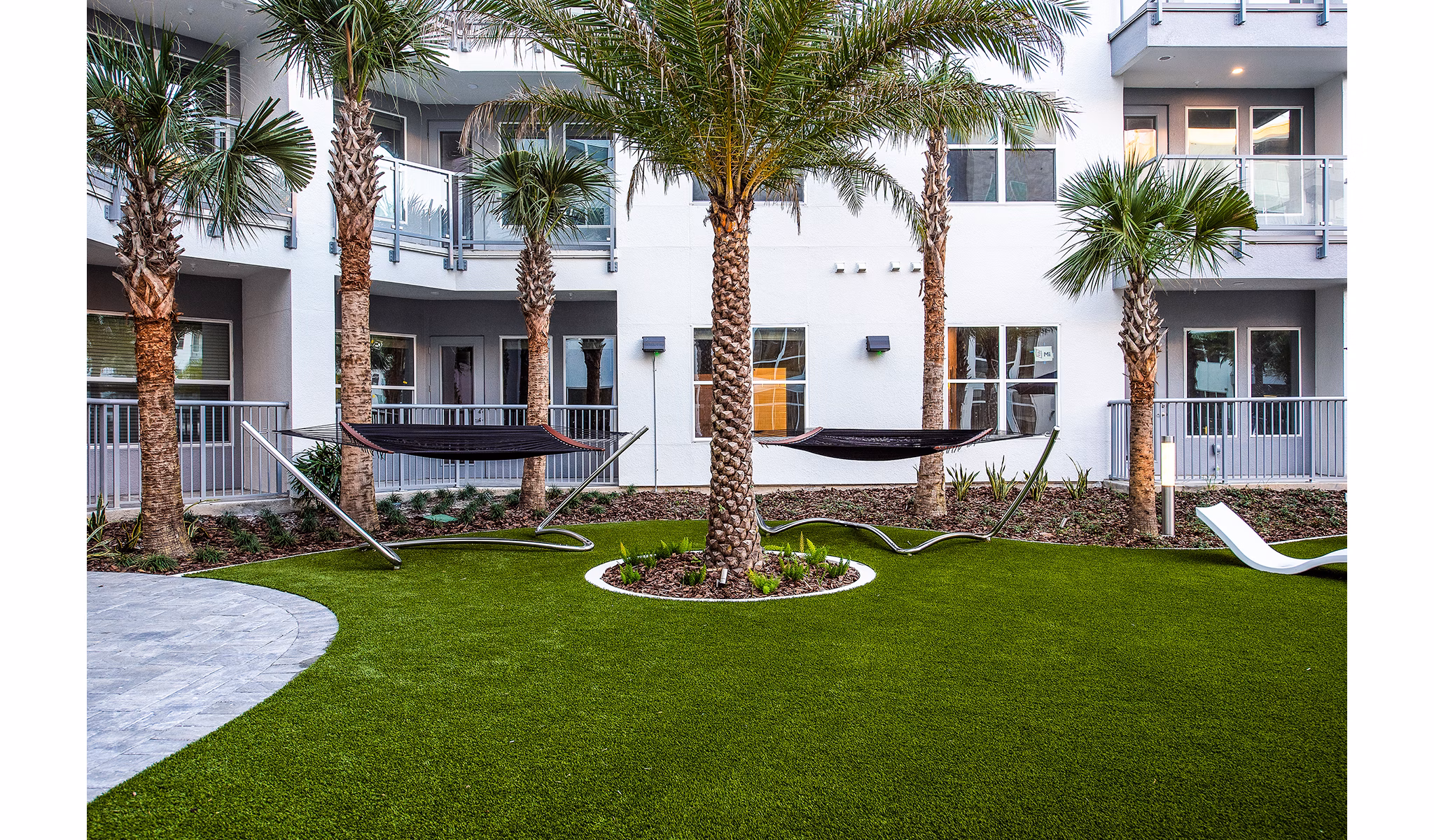 Patio lounge area with comfortable seating at Sanctuary at Centerpointe Apartments