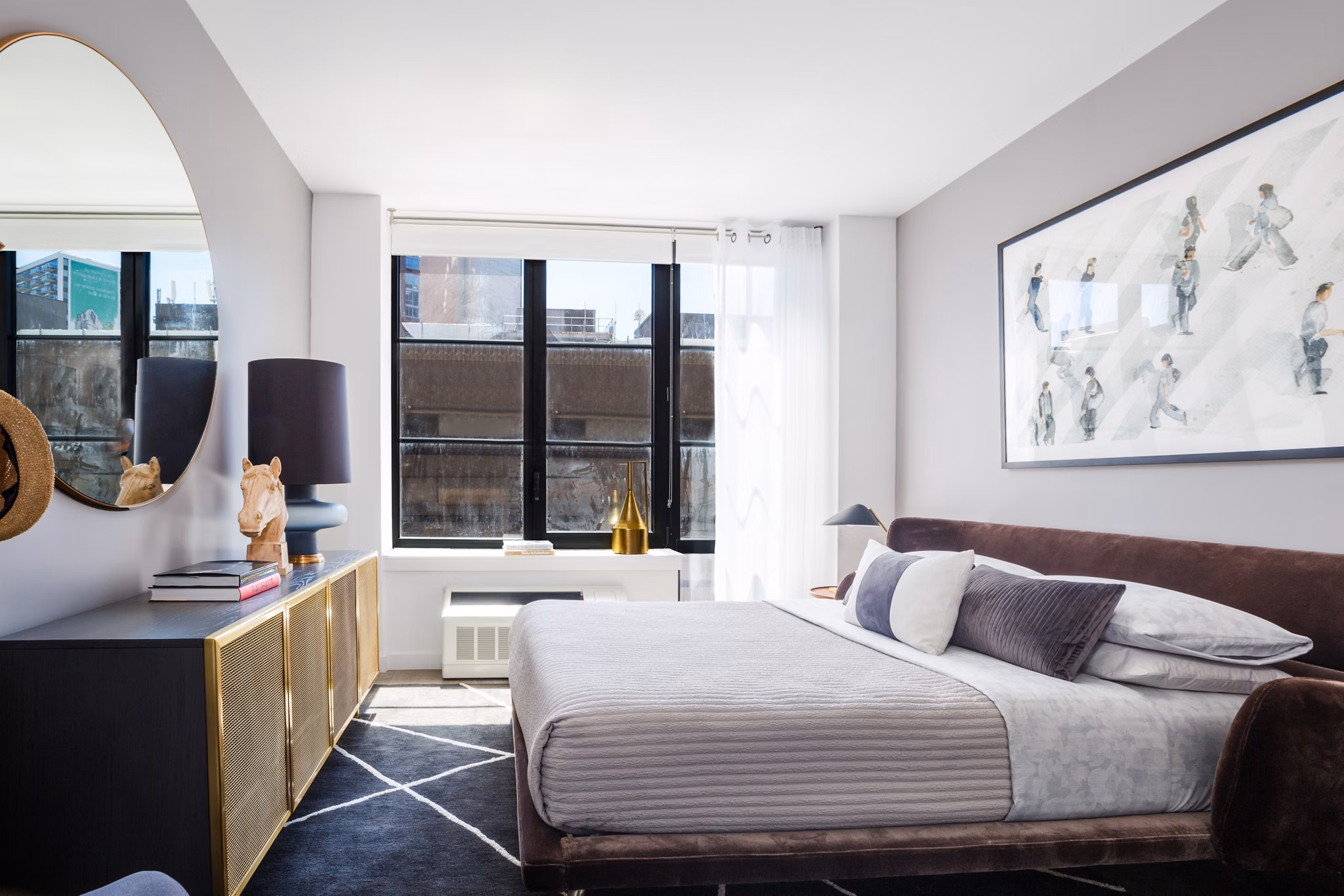 Cozy bedroom with modern decor in 1 Flatbush Apartments, offering luxury living in the heart of Brooklyn