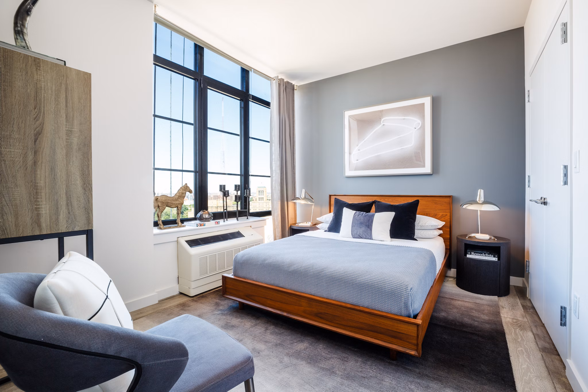 Modern bedroom featuring sleek furniture and natural light at 1 Flatbush Apartments